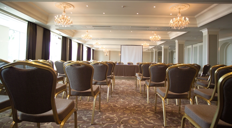 Elegant meeting room at L'Horizon Beach Hotel, ideal for corporate events and conferences.