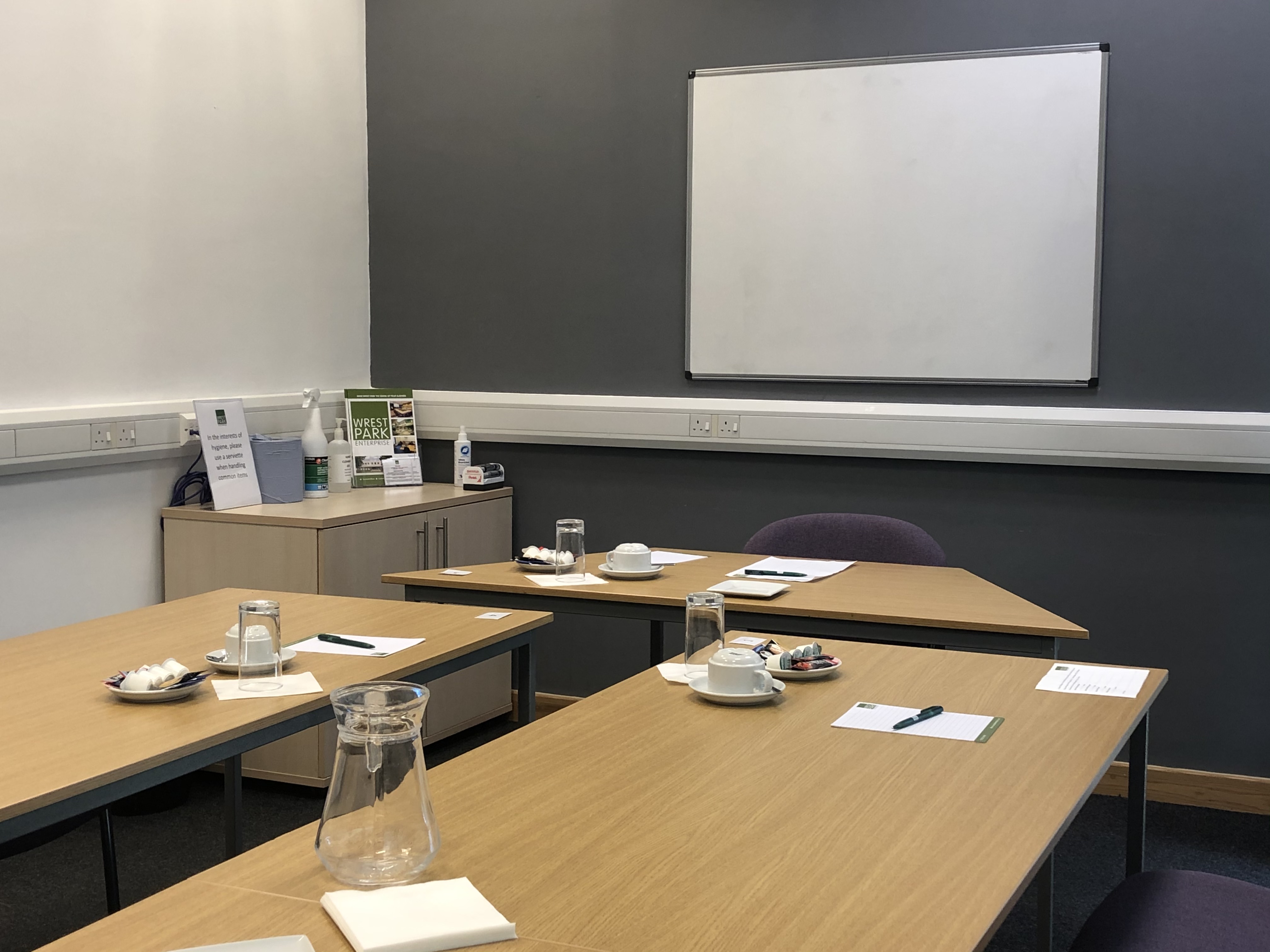 Boardroom in Capability House with organized tables for workshops and meetings.
