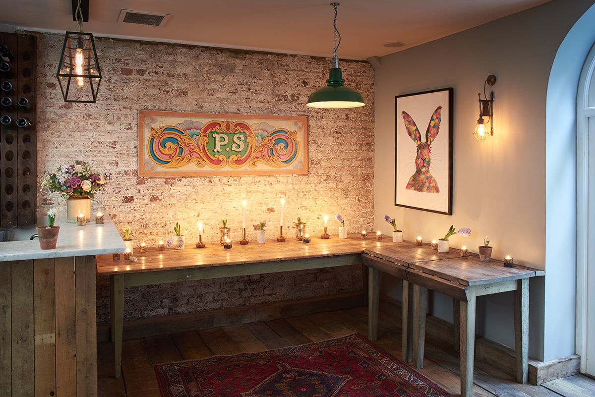 Cozy event space with rustic decor and artistic elements at Artist Residence London.