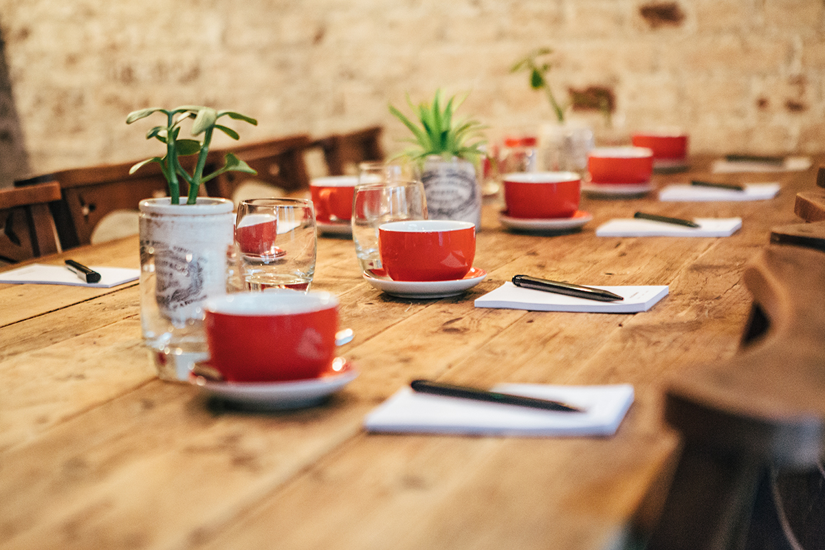 Club Room at Artist Residence London with rustic table, ideal for meetings and creativity.