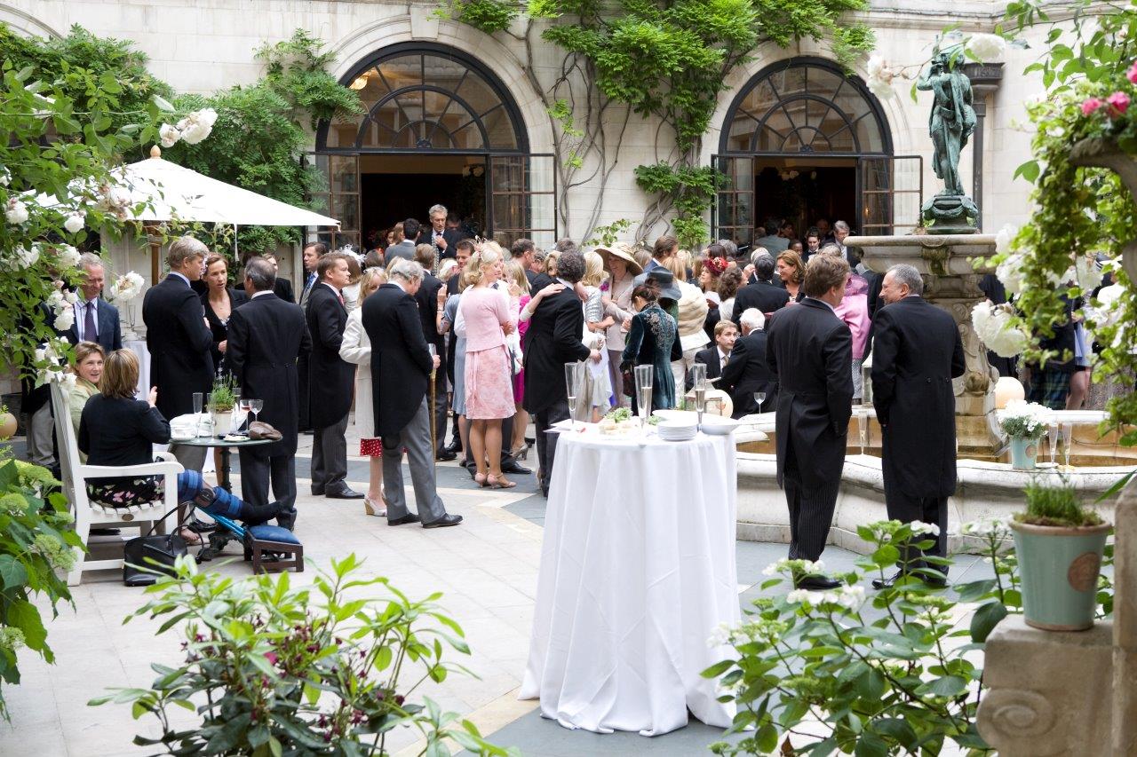 Courtyard Garden at Merchant Taylors' Hall, vibrant outdoor networking event with lush greenery.