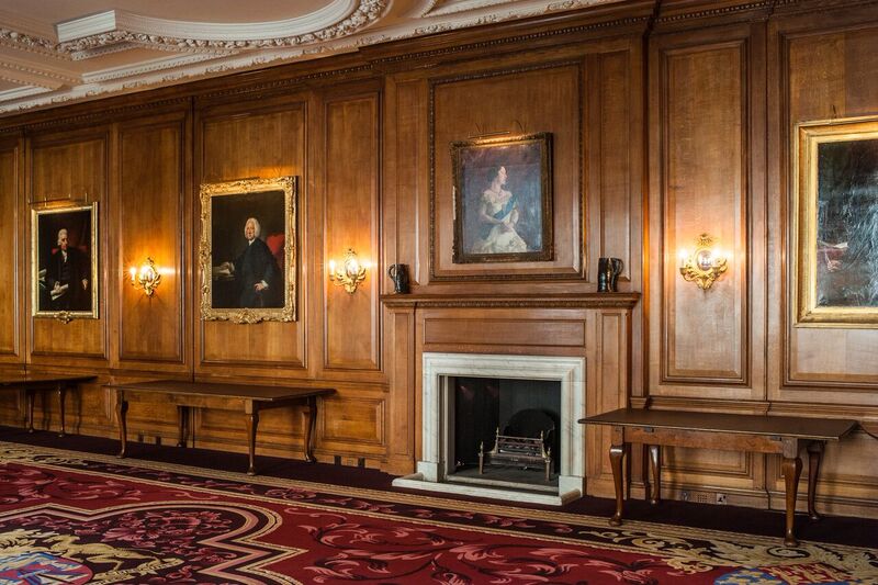 Sophisticated event space with wooden paneling at Merchant Taylors' Hall for gatherings.