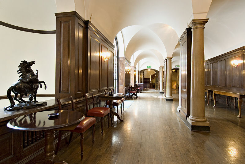Elegant wooden-paneled event space at The Cloisters, perfect for receptions and gatherings.