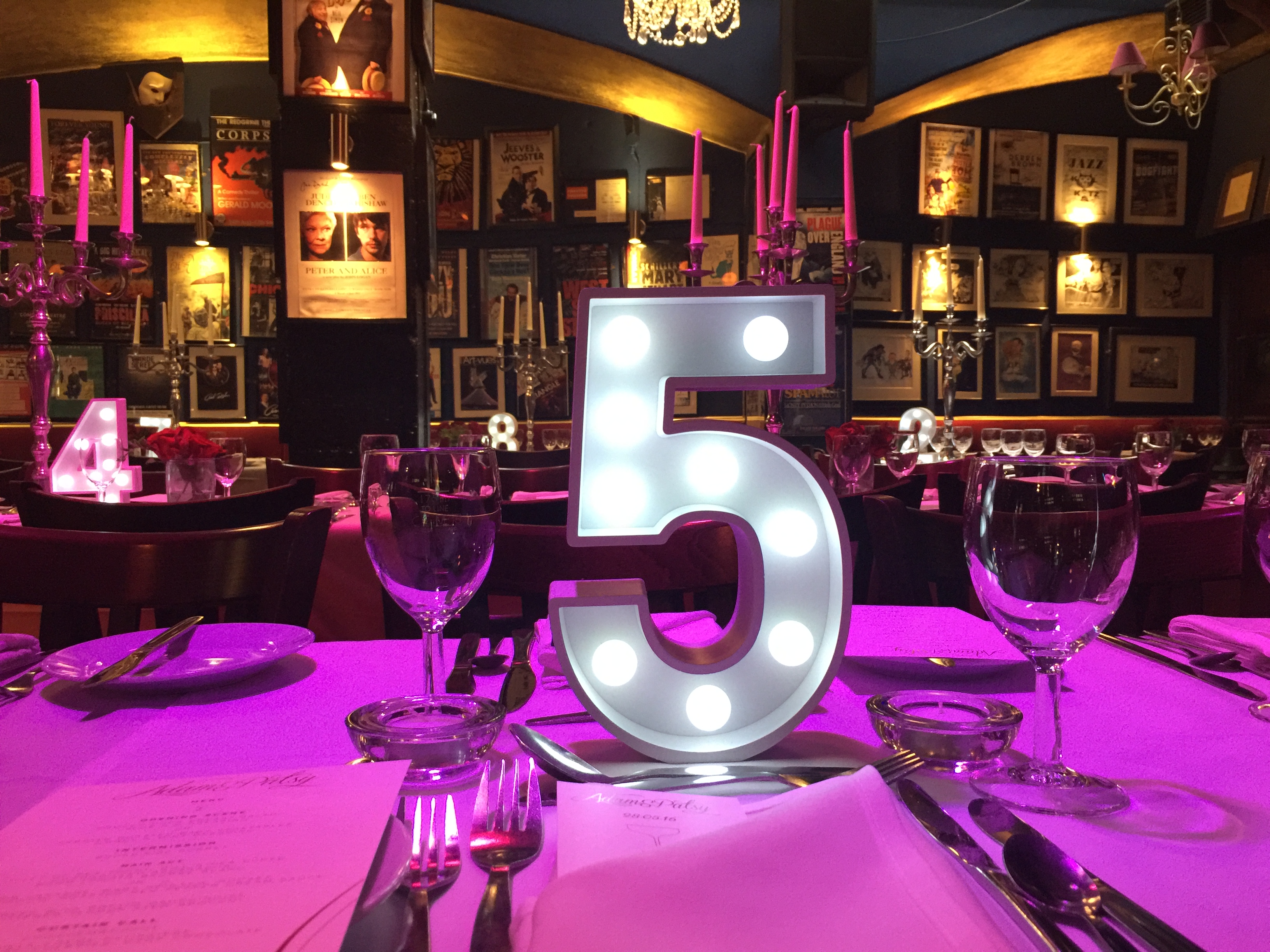 Elegant dining table setup at Phoenix Arts Club for events, featuring warm lighting and decor.