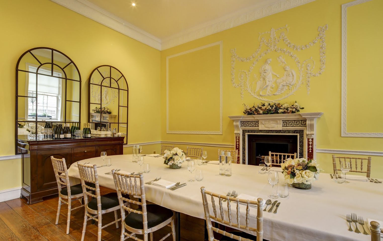 Hutchison Room at Asia House: elegant meeting space with floral centerpieces for corporate events.