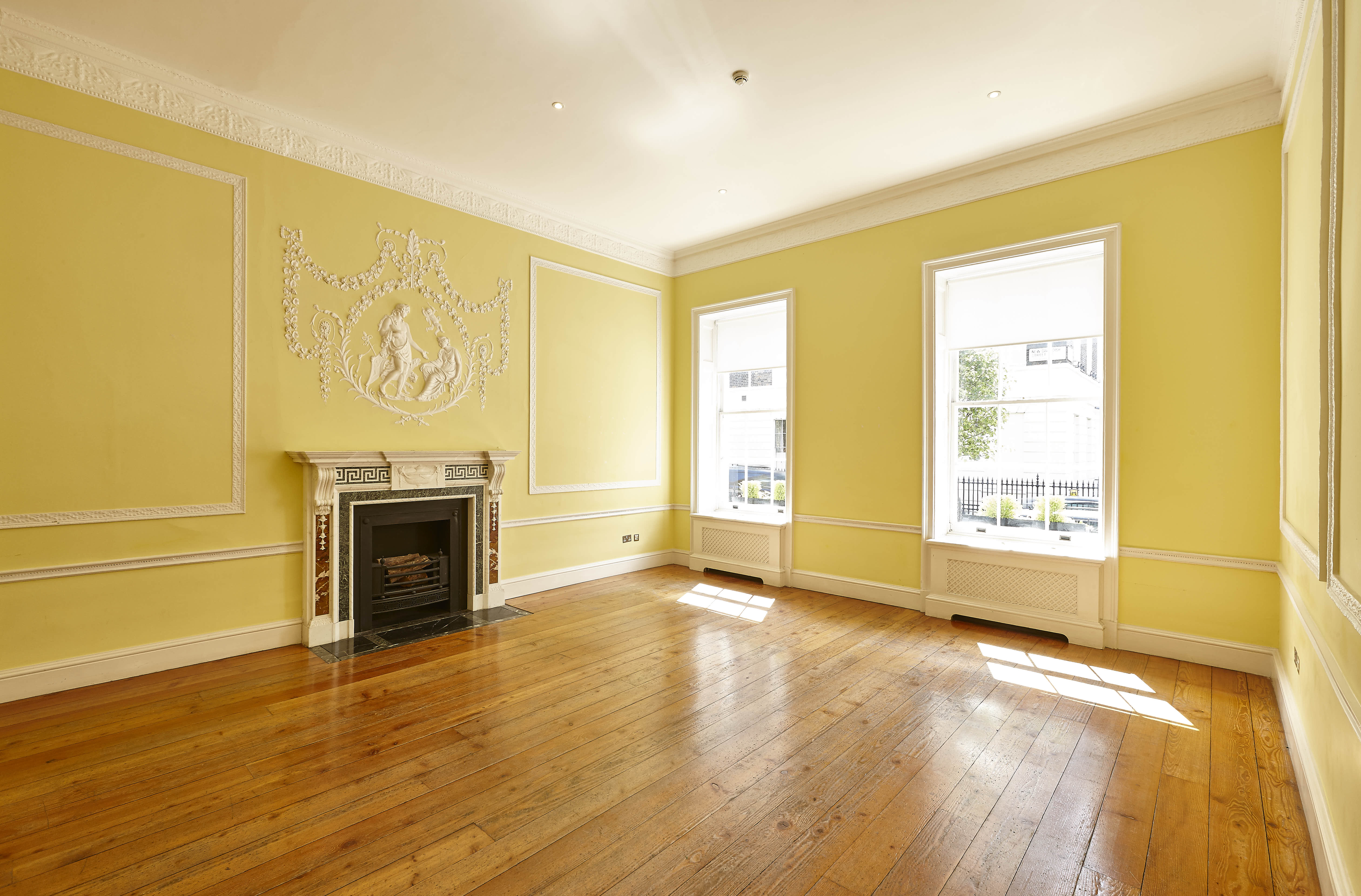 Elegant meeting space in Hutchison Room, Asia House with natural light and classic fireplace.