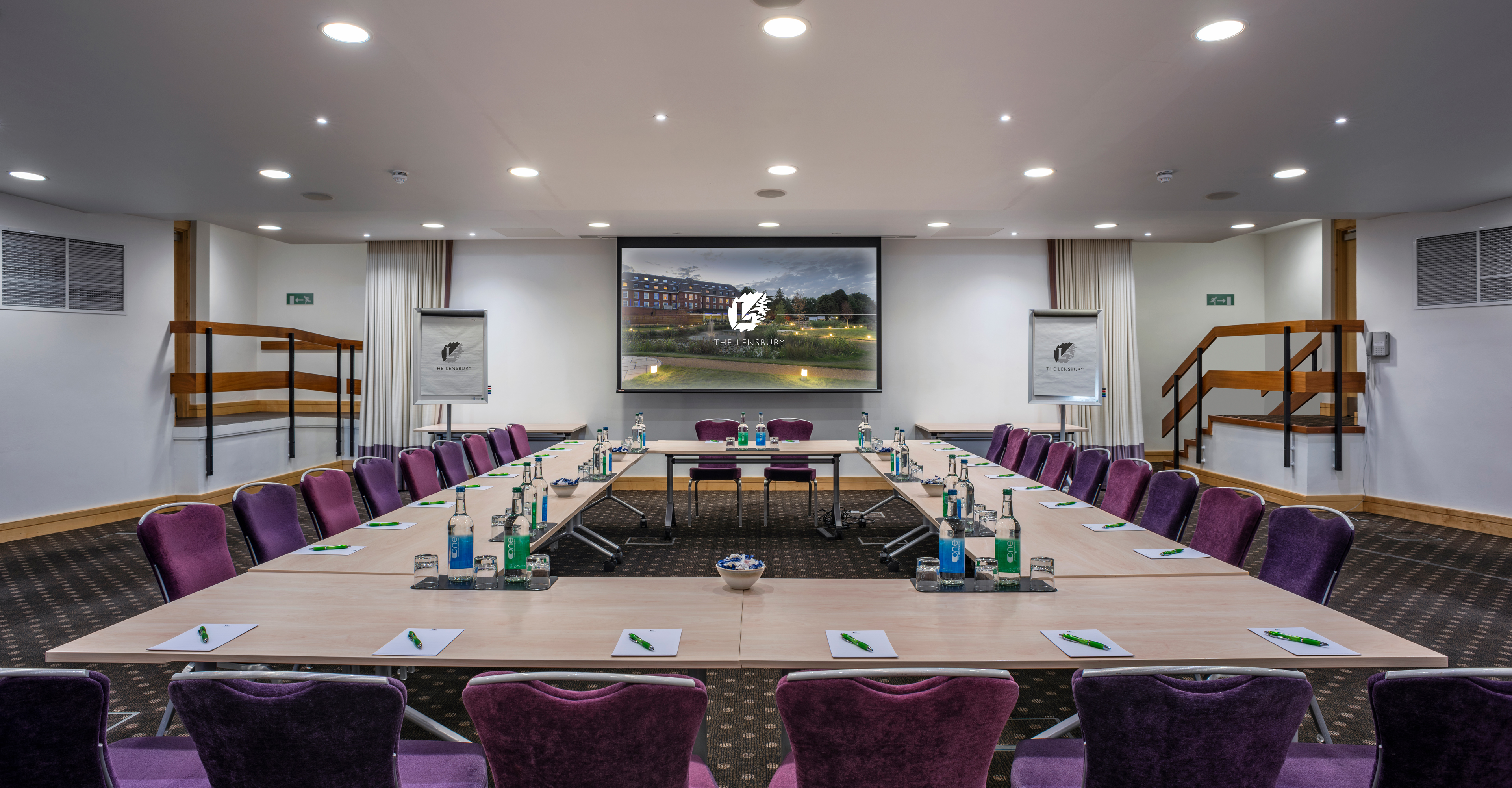 Beaumont Room at The Lensbury: modern meeting space with purple chairs for corporate events.