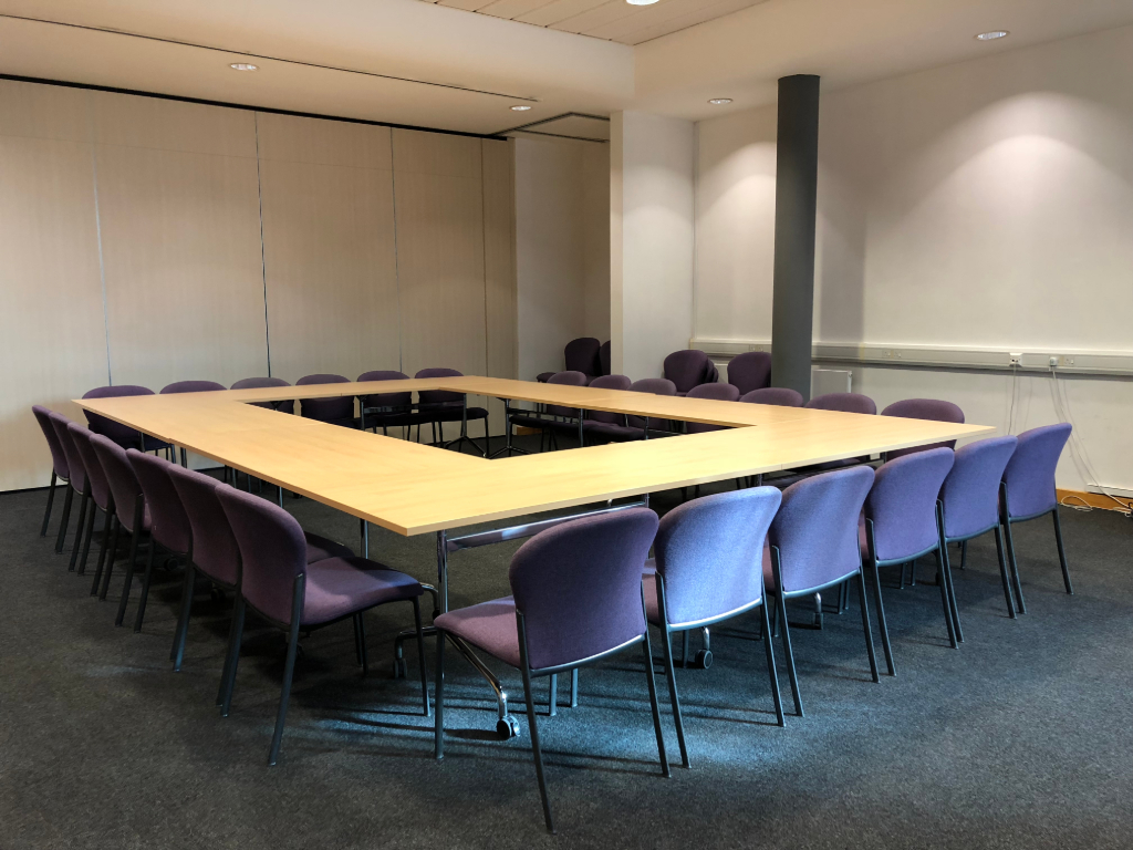 U-shaped conference room in Capability House, ideal for meetings and collaborative discussions.