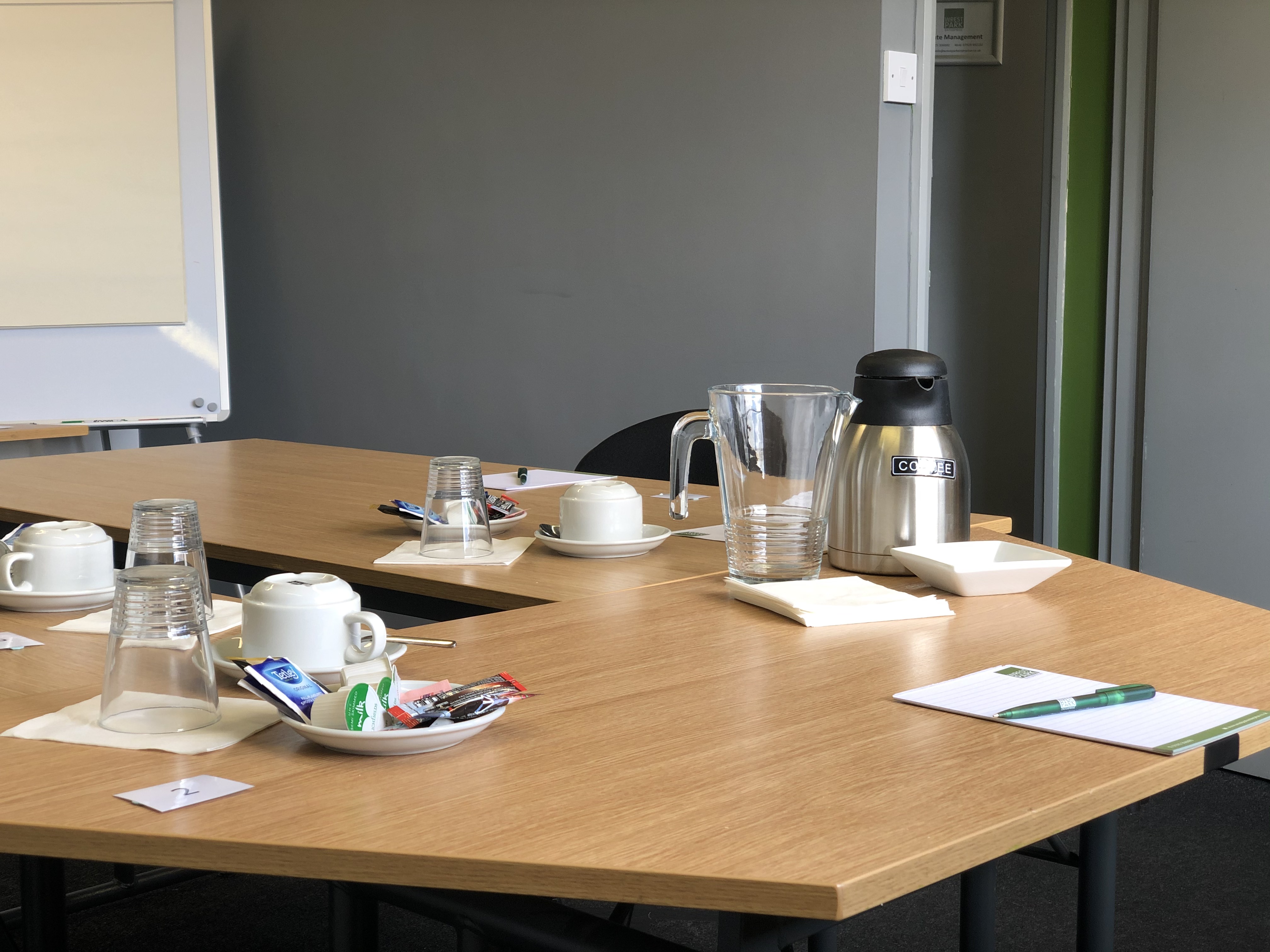 Meeting room setup in Enterprise House with a clean table, ideal for collaboration.