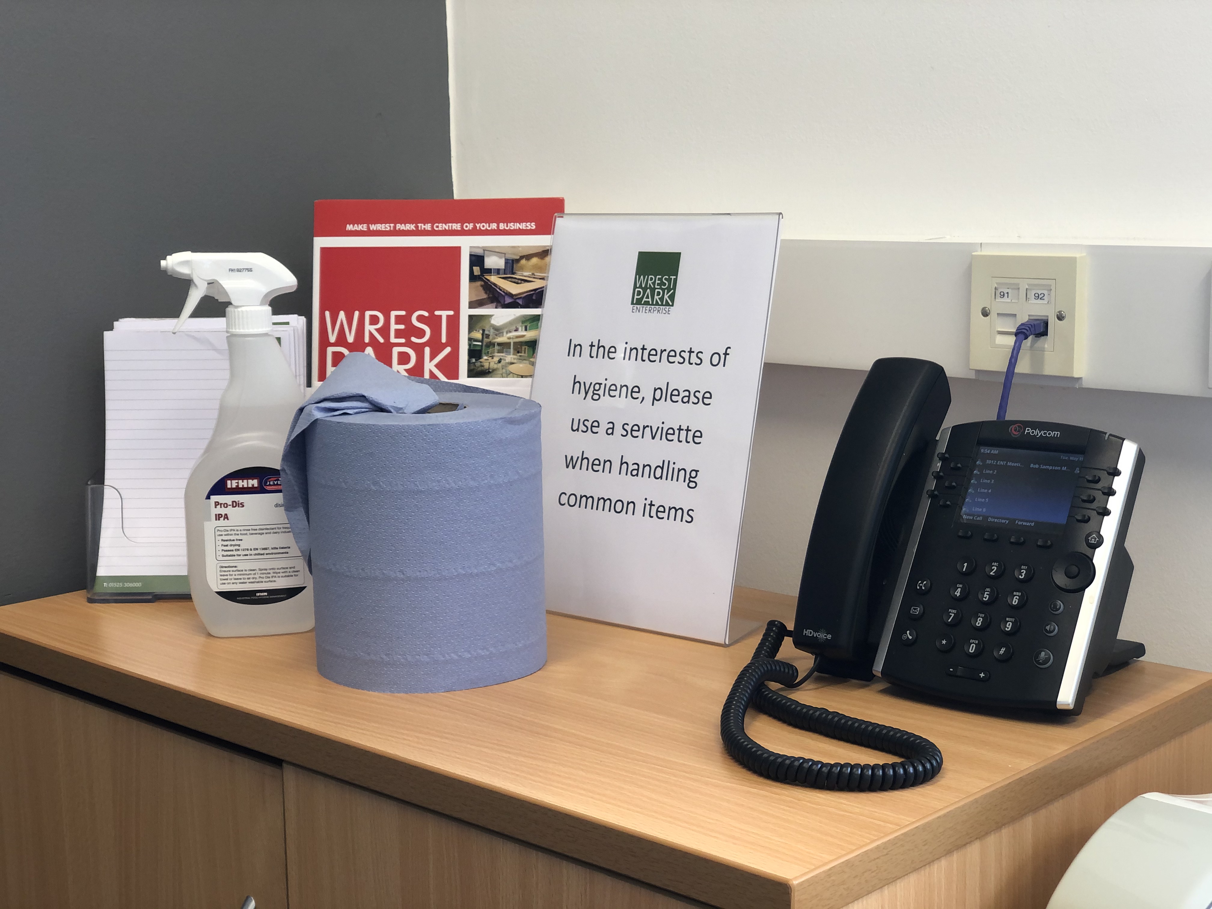 Well-organized meeting room with hygiene supplies for safe events in Enterprise House.
