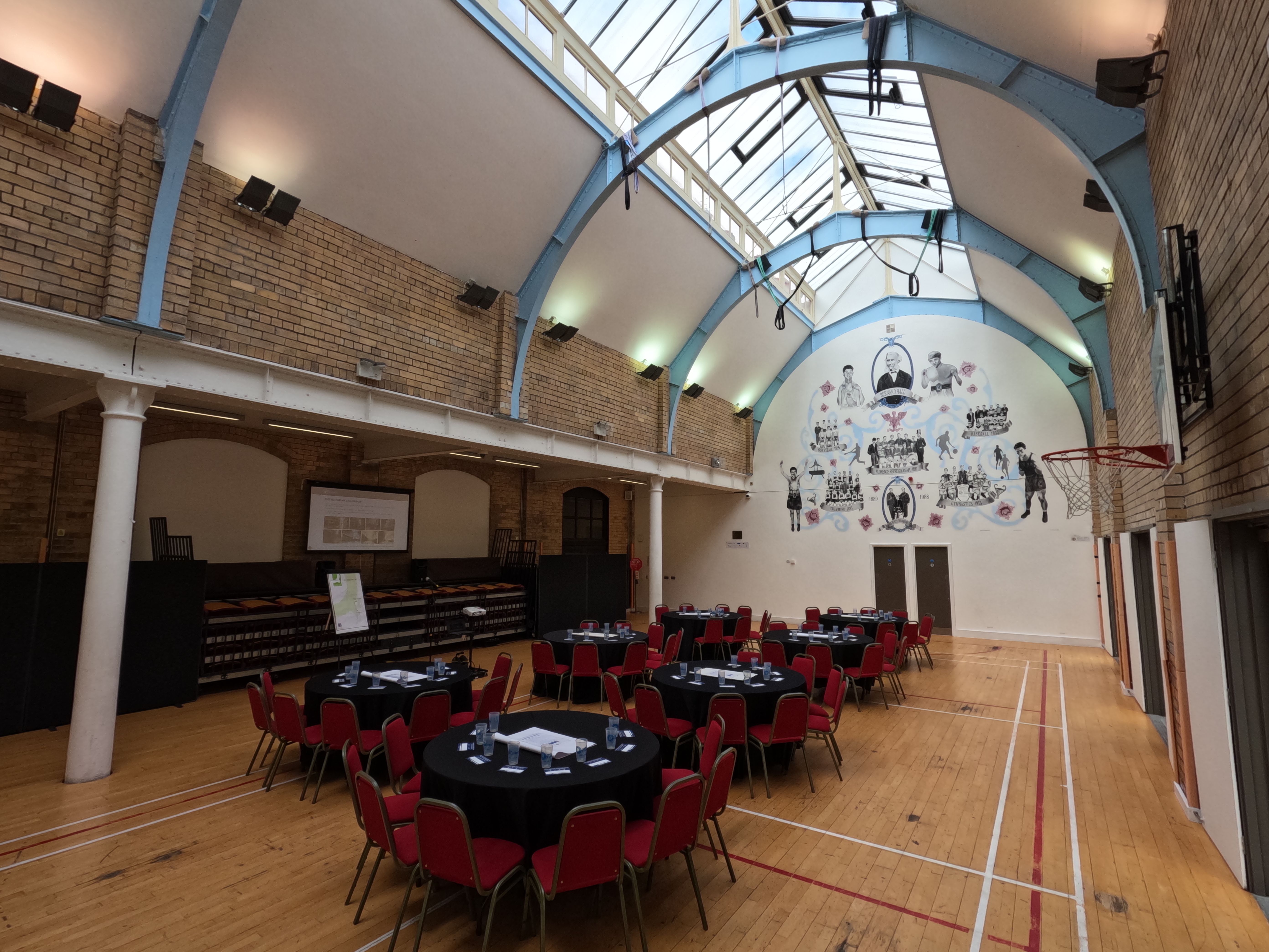Versatile event space at The Florrie with round tables and natural light for meetings or banquets.