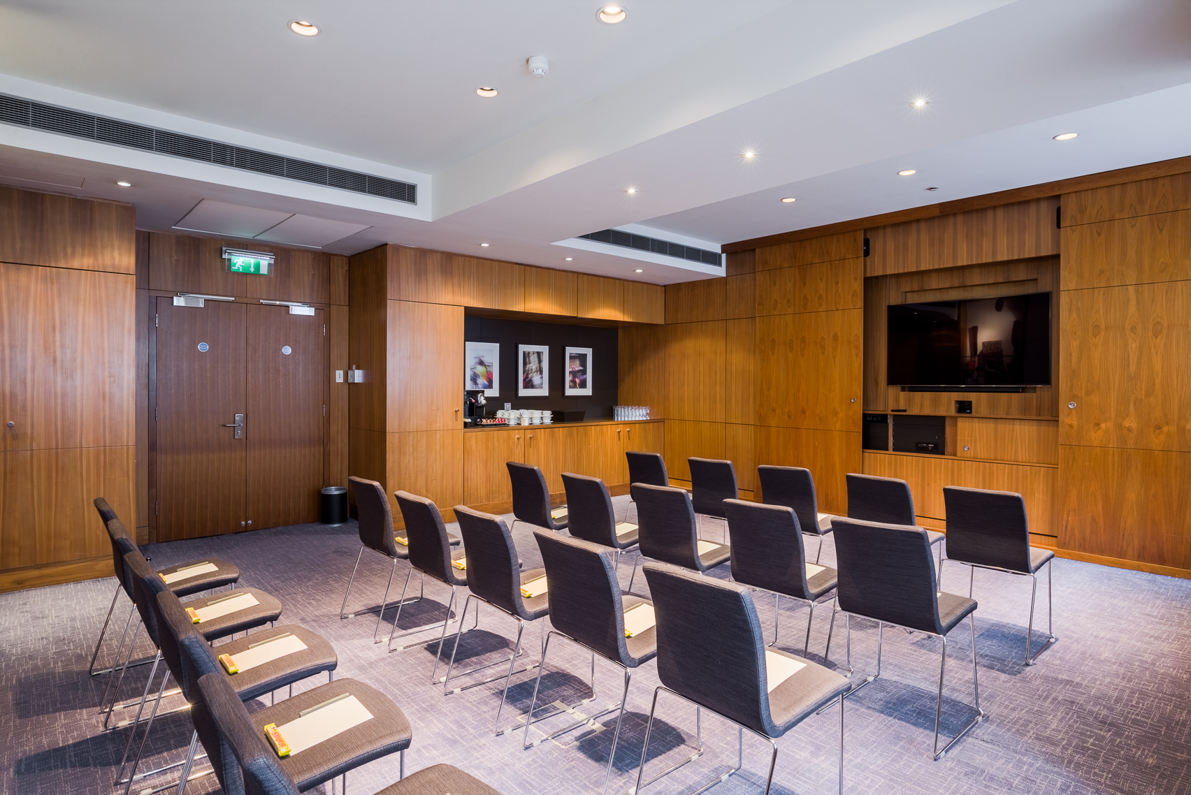 Moorgate Suite meeting room with wood paneling for corporate events and presentations.