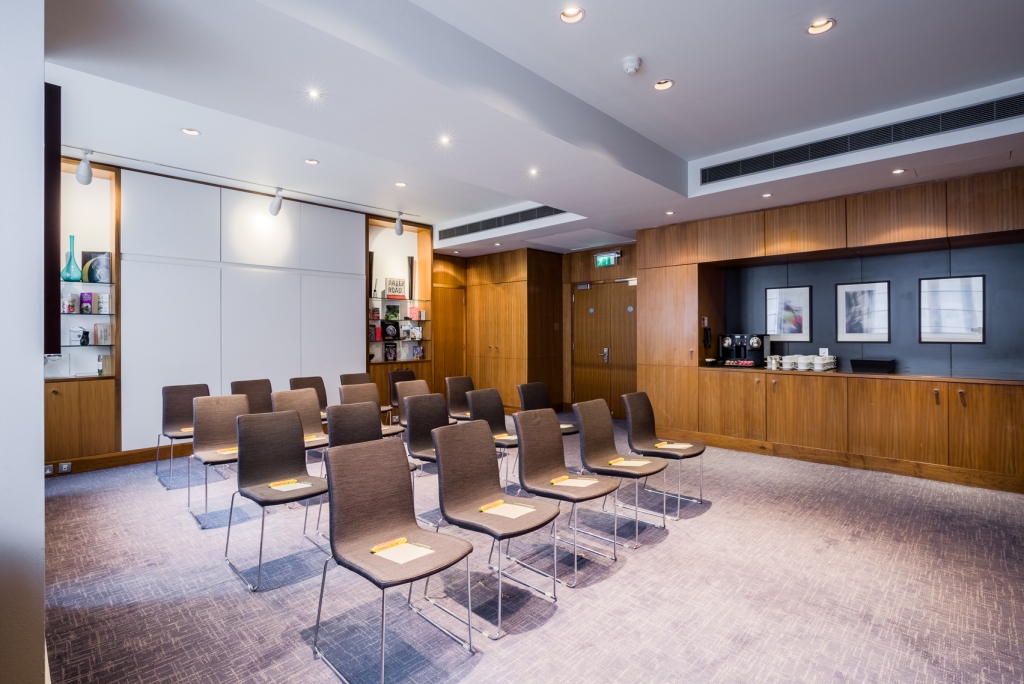 Moorgate Suite meeting room with warm wood accents, perfect for workshops and gatherings.