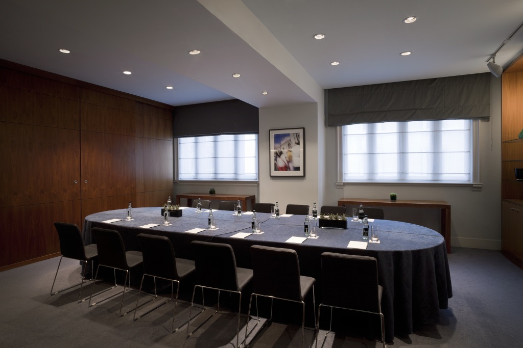 Moorgate Suite at Andaz London: modern meeting room with round table for strategic planning.