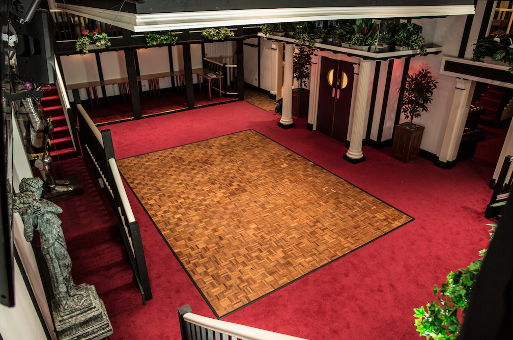 Spacious Hunt's Lounge venue with polished dance floor, ideal for events and celebrations.