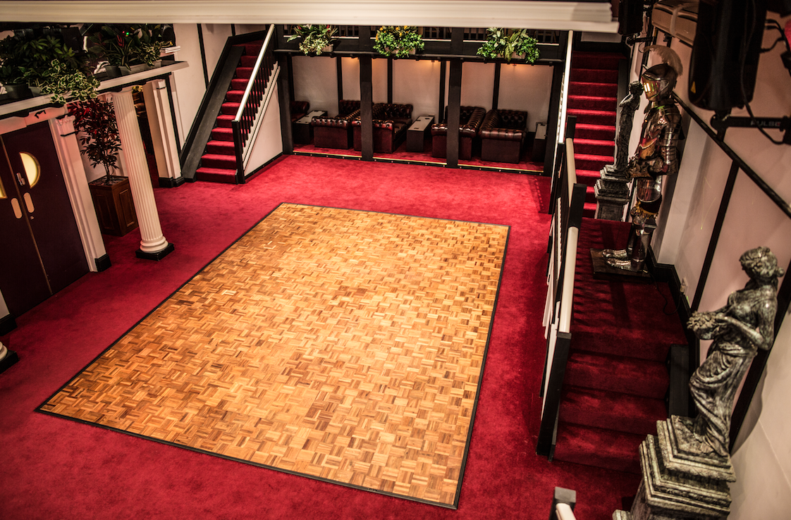 Hunt's Lounge event space with polished dance floor and elegant decor in Chessington.