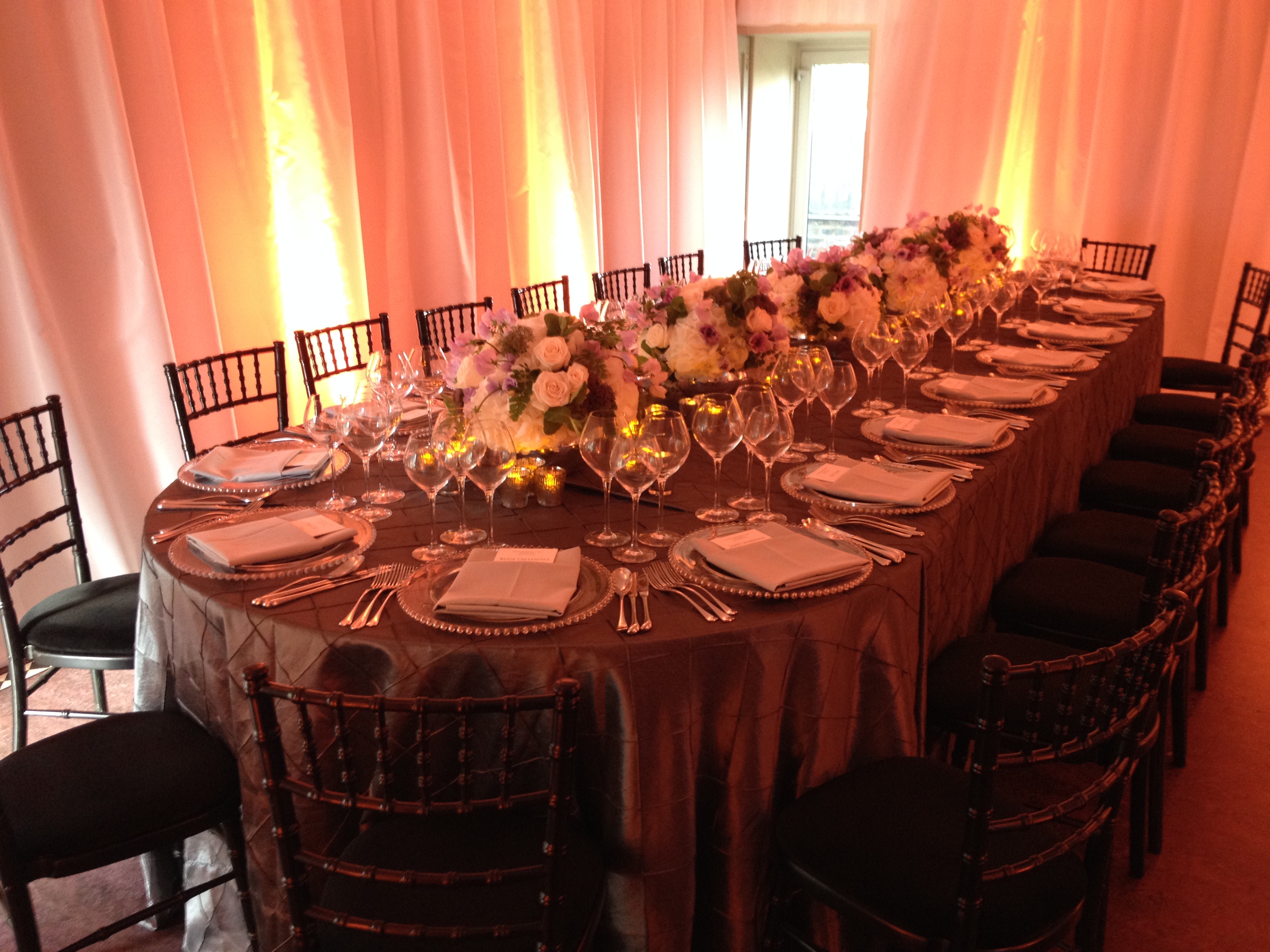 Elegant banquet table with floral centerpieces at Wellington Arch for upscale events.
