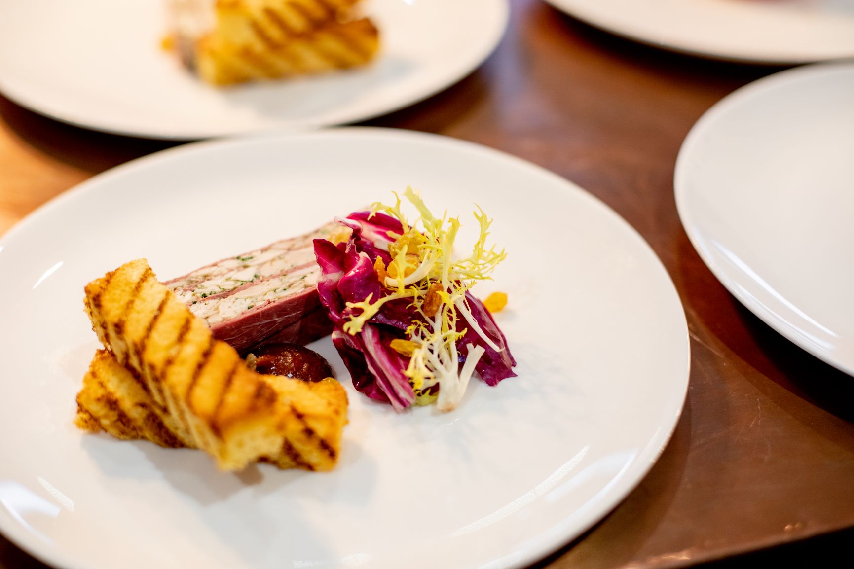 Upscale plated dish at Ascot Racecourse for corporate events and elegant receptions.