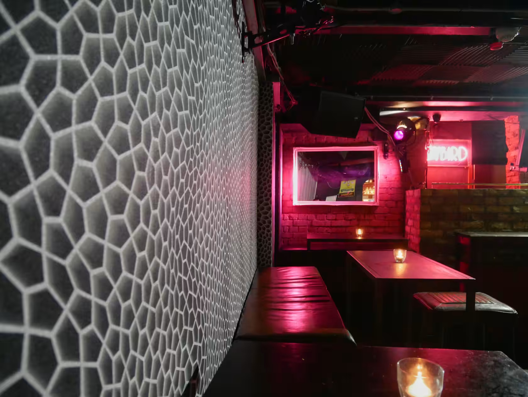 Stylish venue with textured walls, ideal for intimate gatherings and networking events.