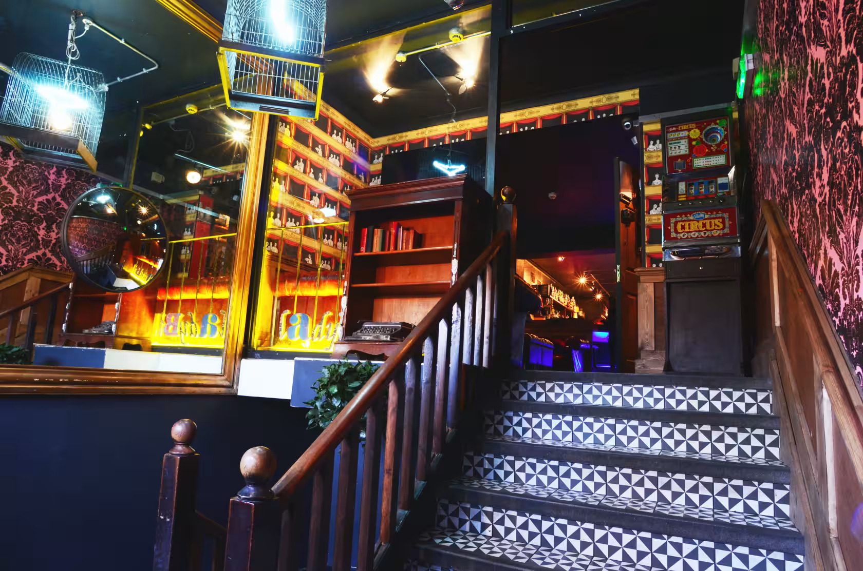 Stylish venue with vintage decor and inviting staircase for events at The Ladybird Bar.