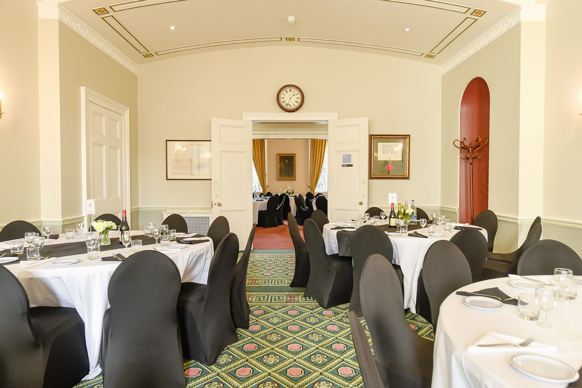 Council Room at SCI Belgravia, elegant round tables, ideal for meetings and events.