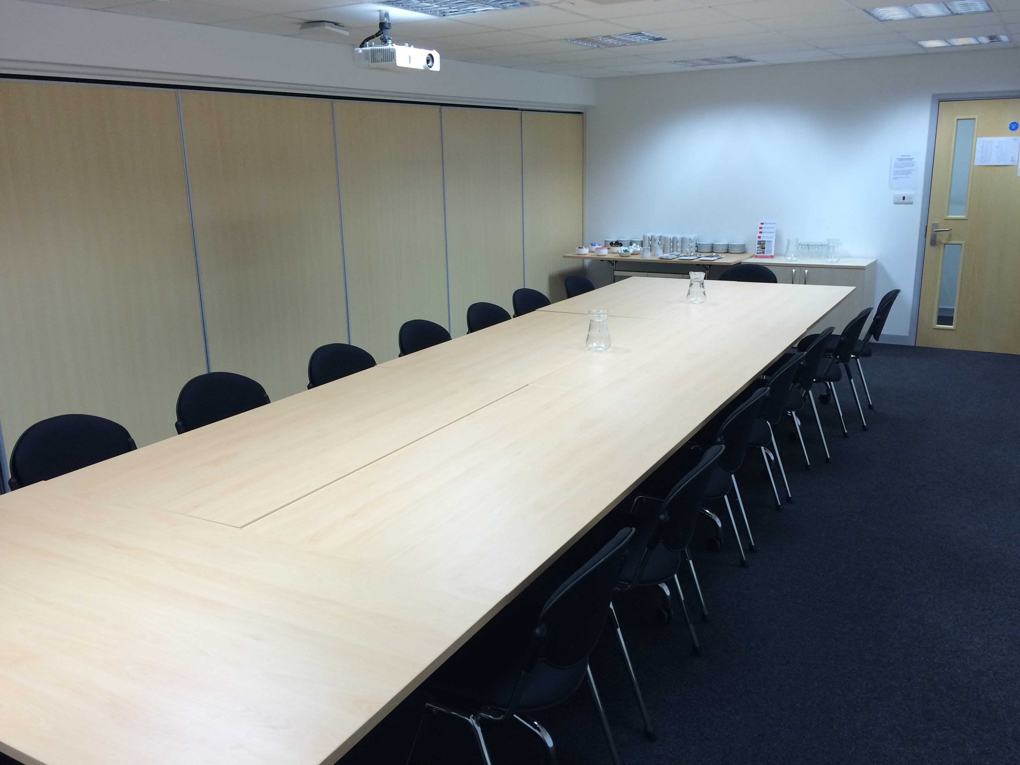 Meeting Room 2 in Pinnacle House with a long table, ideal for workshops and meetings.