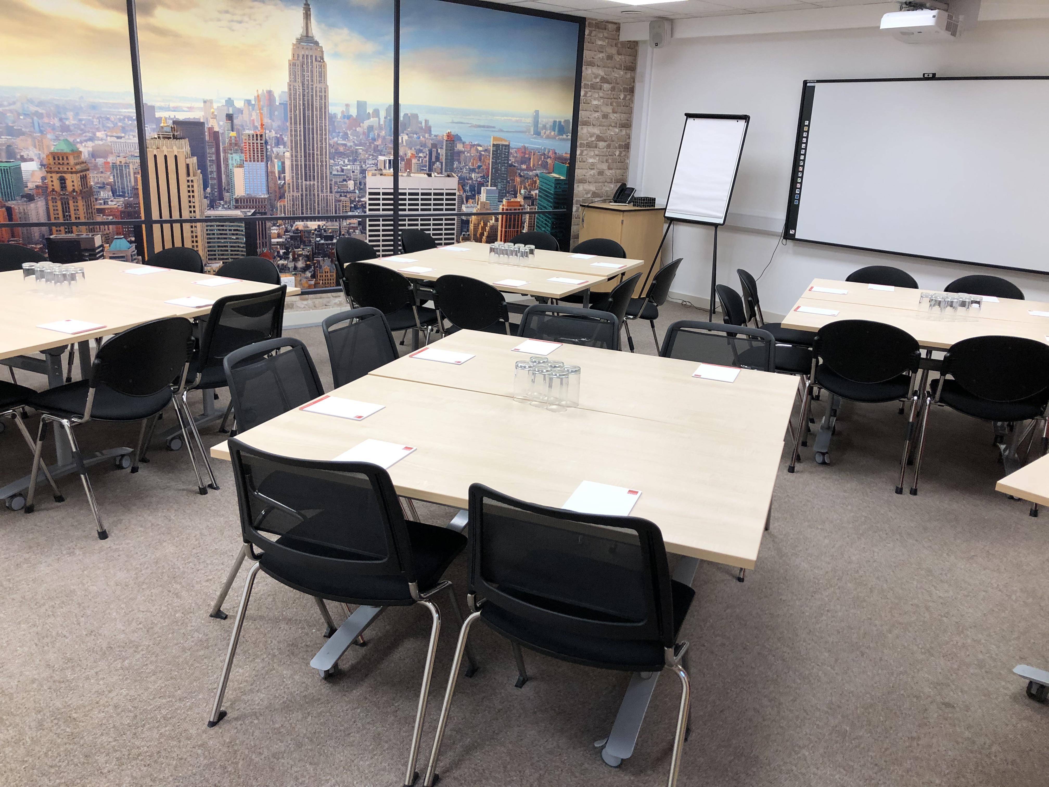 Conference Room in Bowman House with city skyline, ideal for meetings and collaboration.