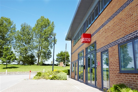 Modern conference room in Bowman House, ideal for meetings and events with natural light.