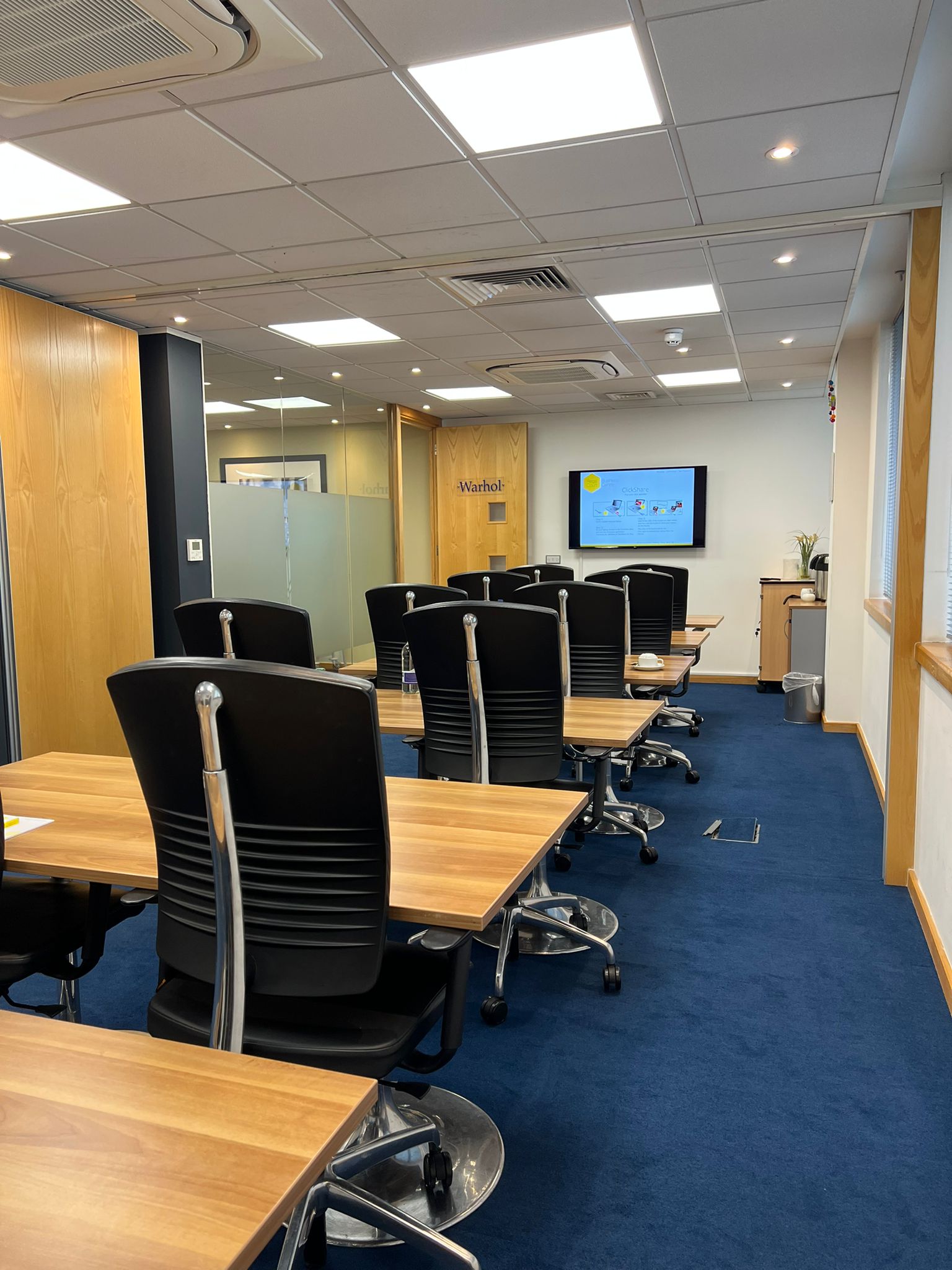 Dali Suite meeting room with ergonomic chairs, ideal for corporate training sessions.