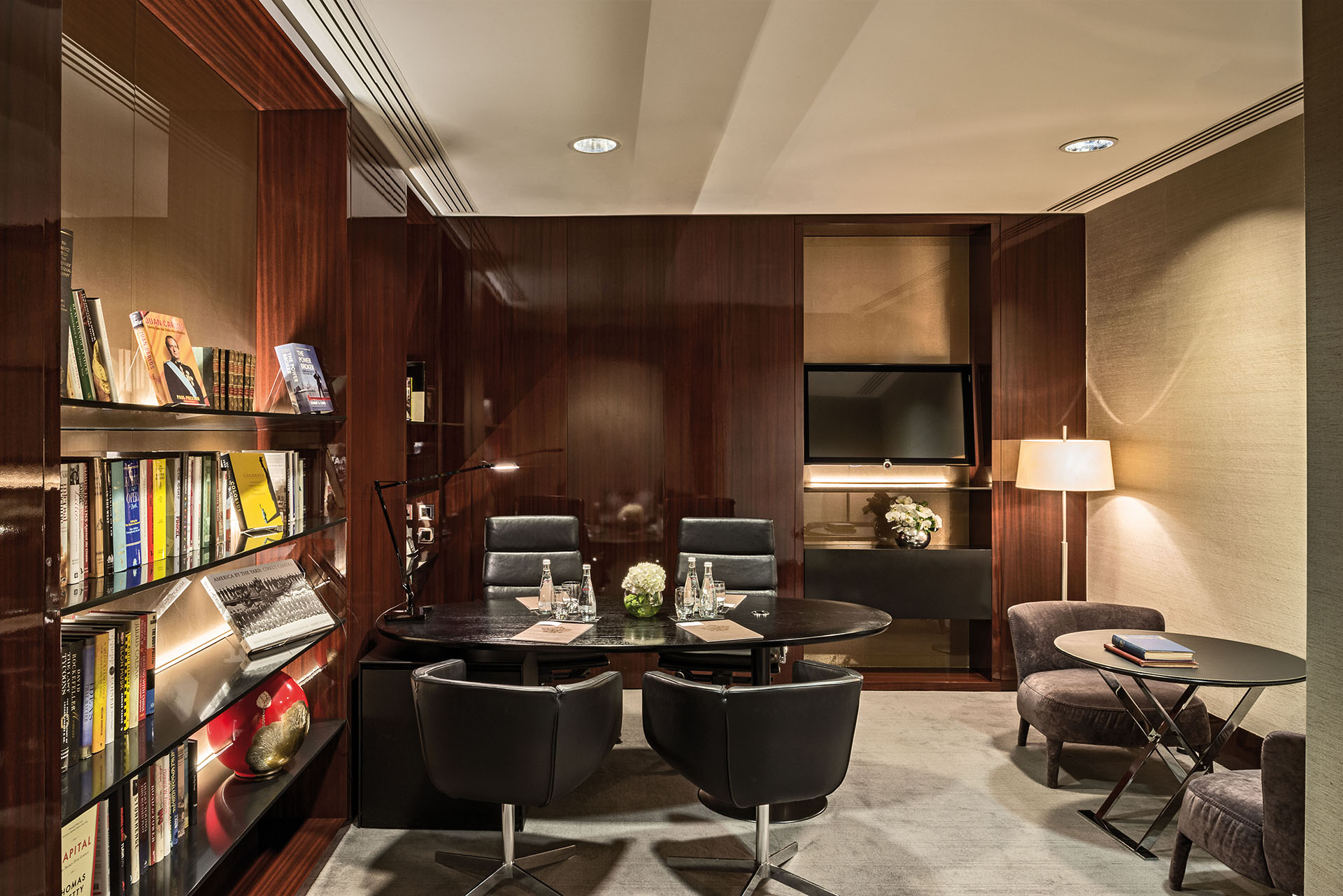 Private office meeting room at Bulgari Hotel London, featuring warm wood finishes and modern design.