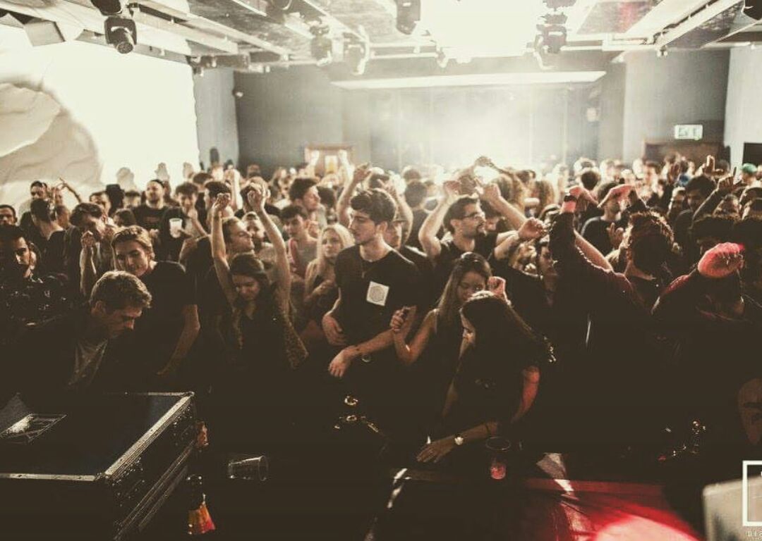 Vibrant crowd at The Bridge London event, showcasing energy and engagement.