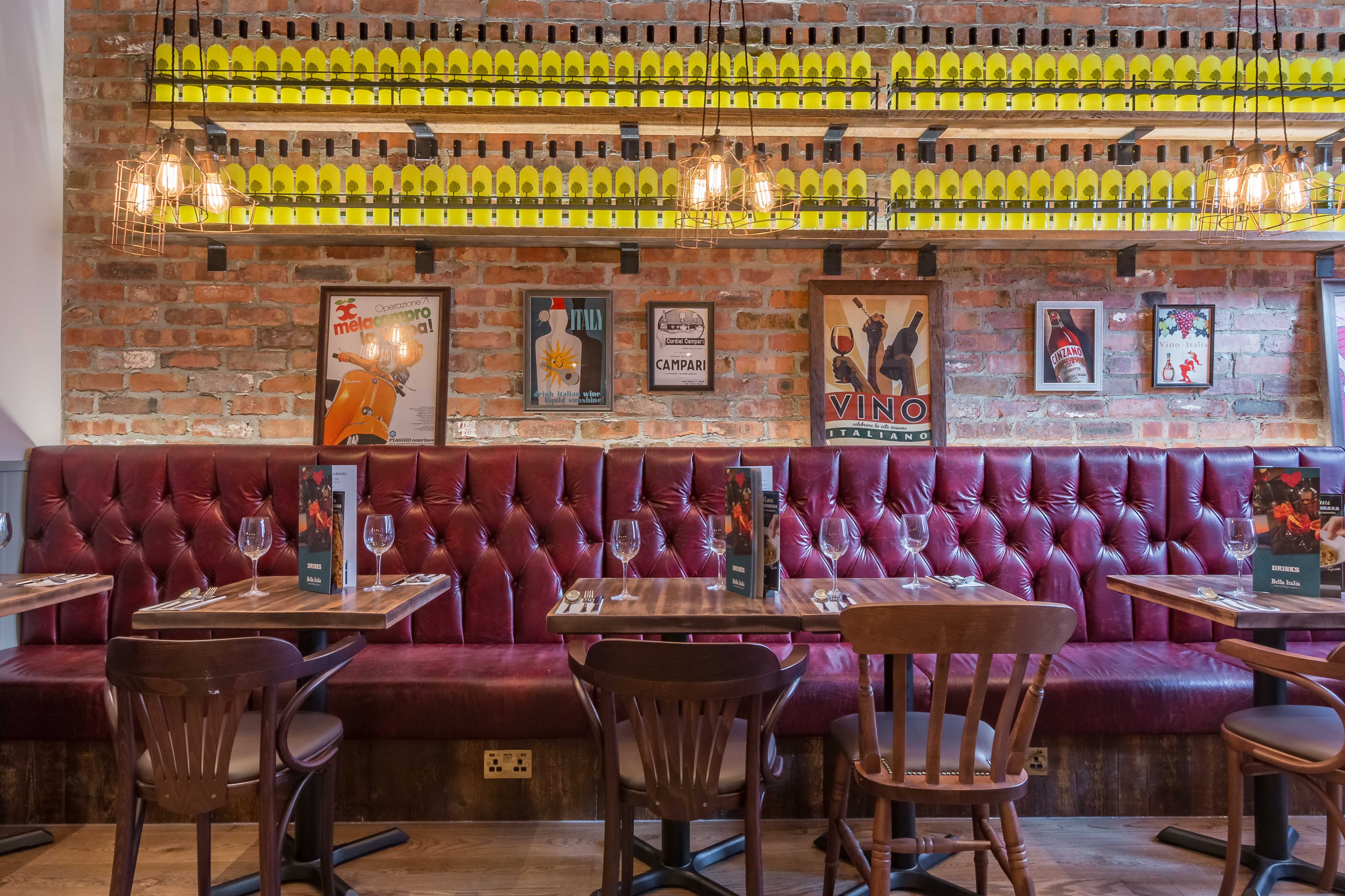 Stylish Venice Room restaurant with burgundy seating, perfect for dining events.