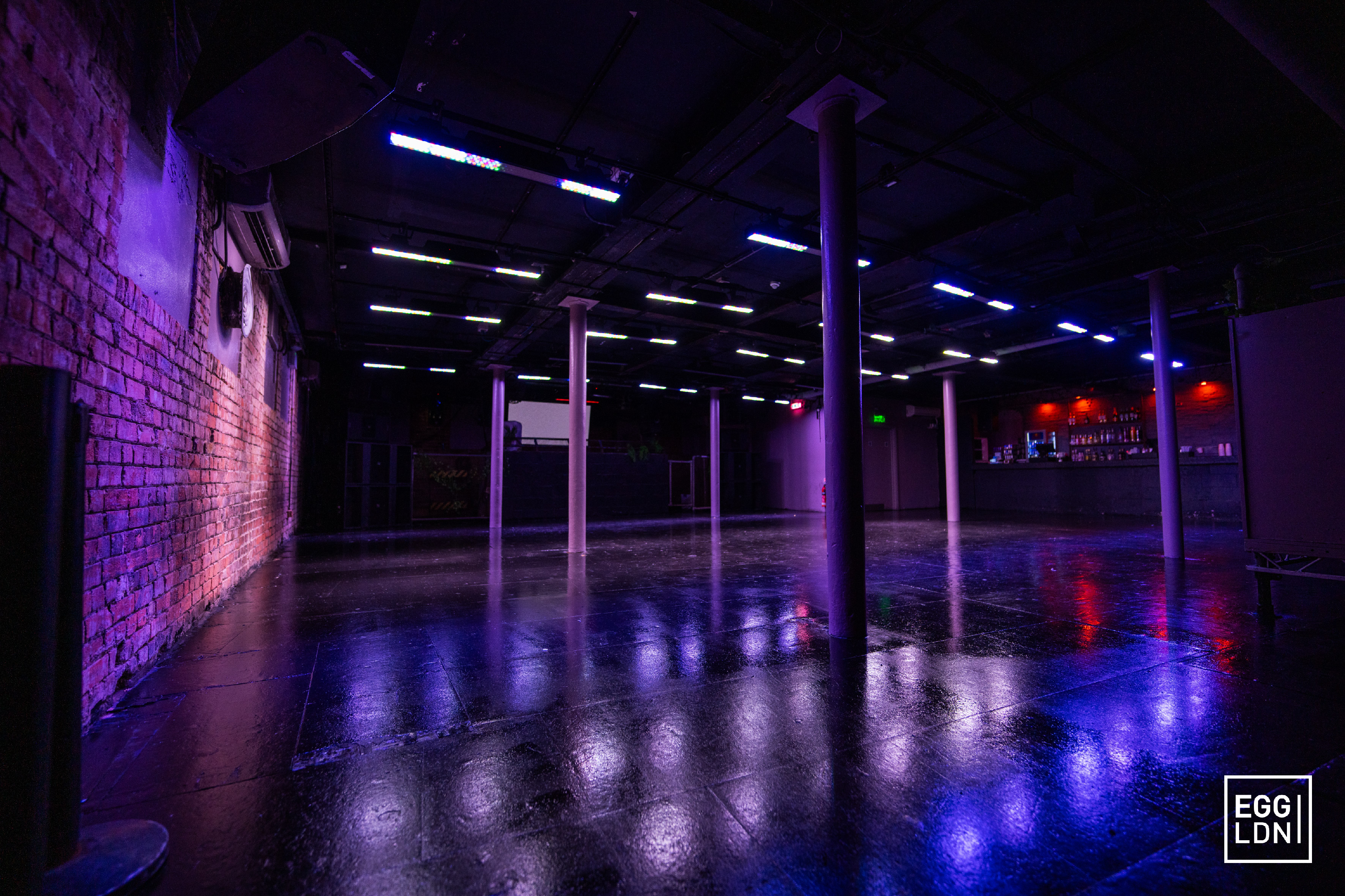 Modern event space with exposed brick and flexible seating at Egg LDN.