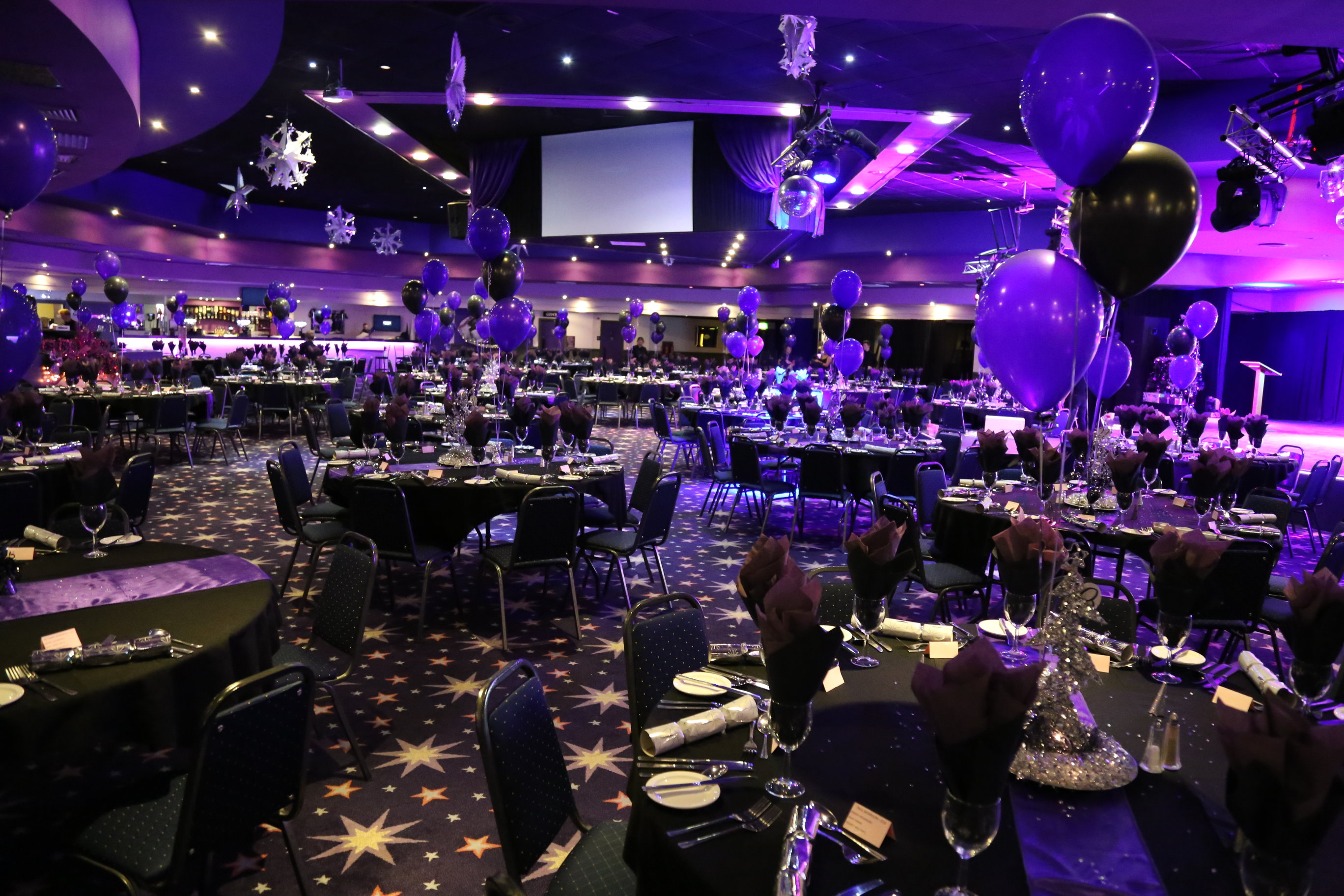 Elegant gala setup in Main Theatre, Viva Blackpool with black and purple decor.