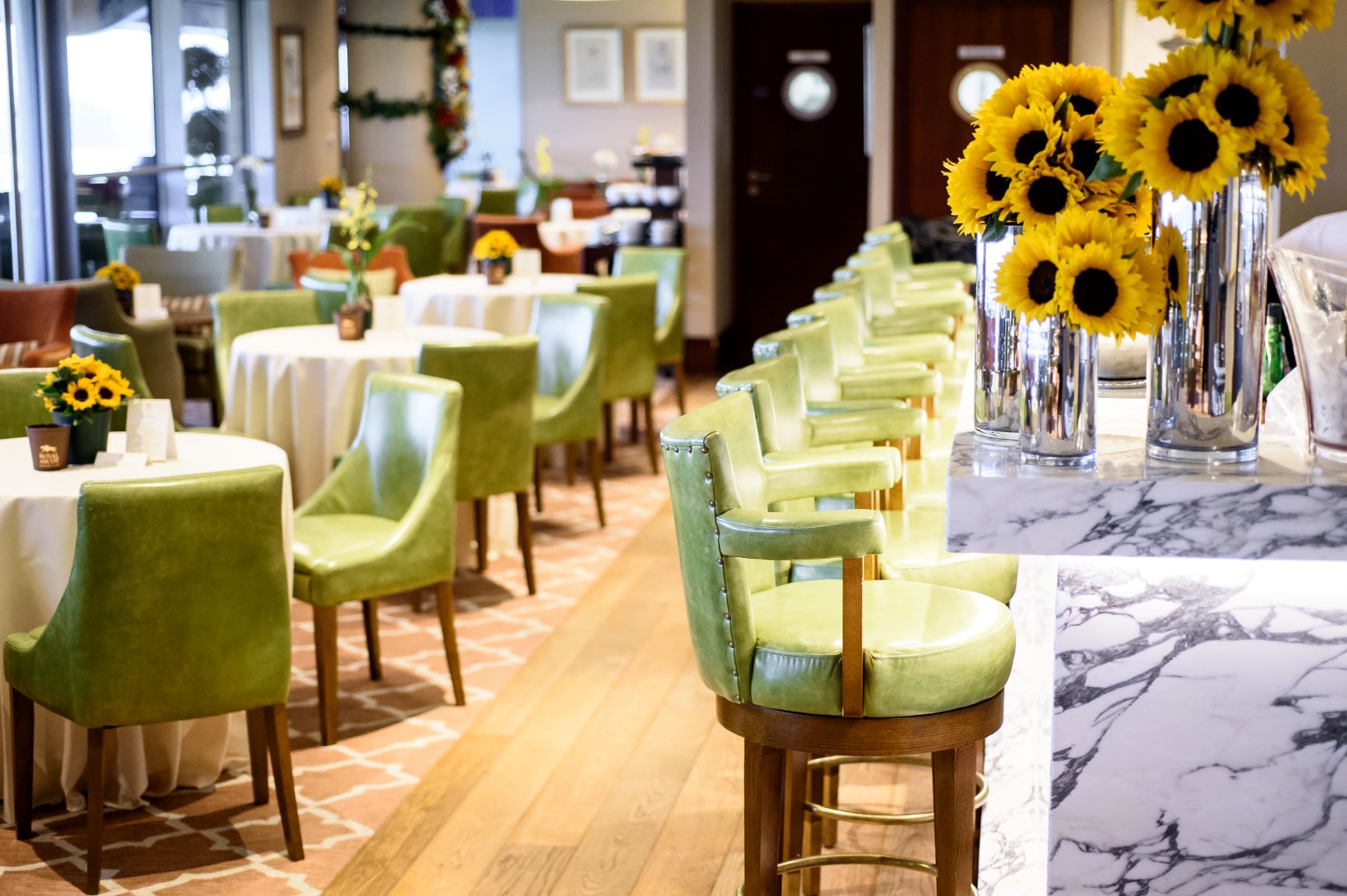 Royal Ascot Racing Club Rooms with vibrant chairs, ideal for networking events.
