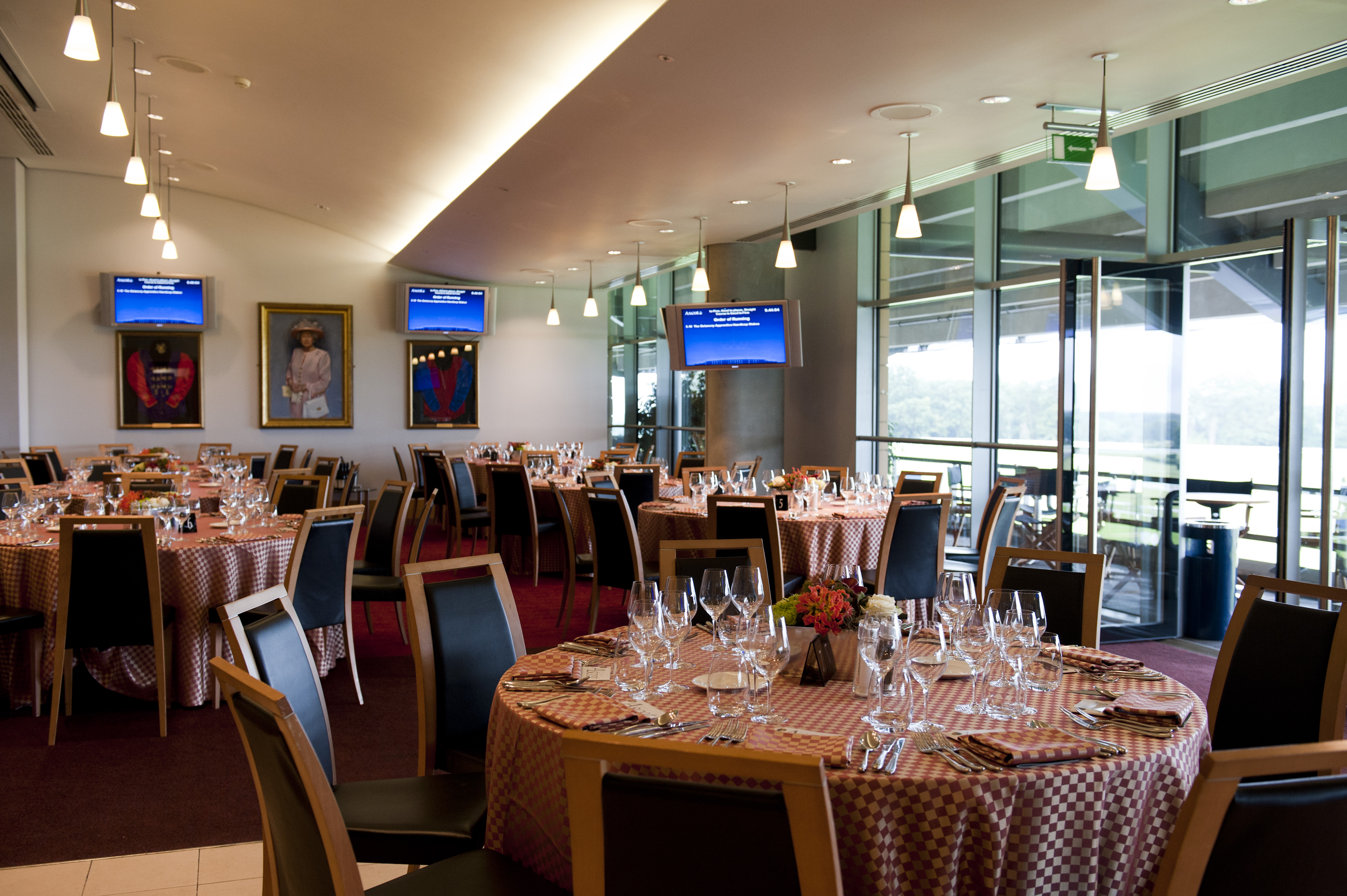 Ascot Authority Suite: elegant event space with round tables for corporate meetings and gatherings.