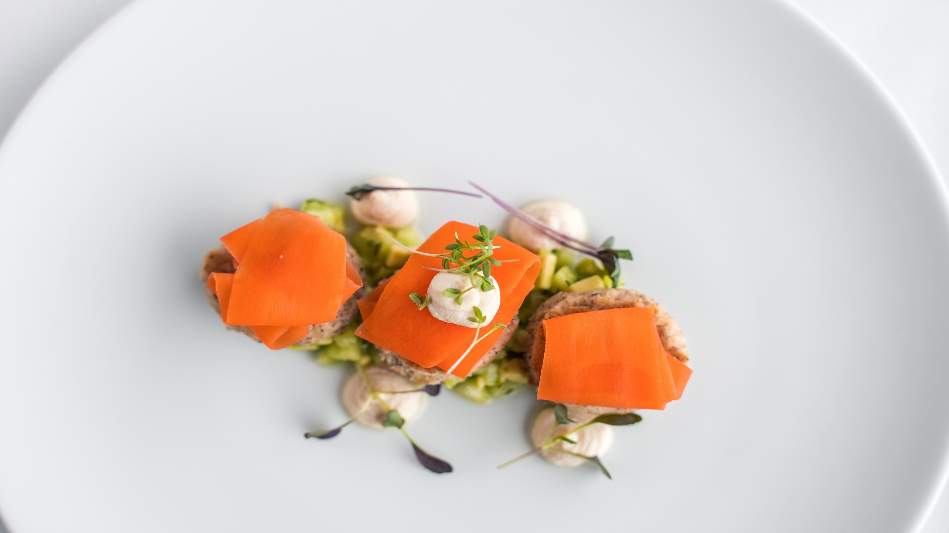 Jockeys' Weighing Room dish: tender meat with vibrant garnishes for events and culinary artistry.