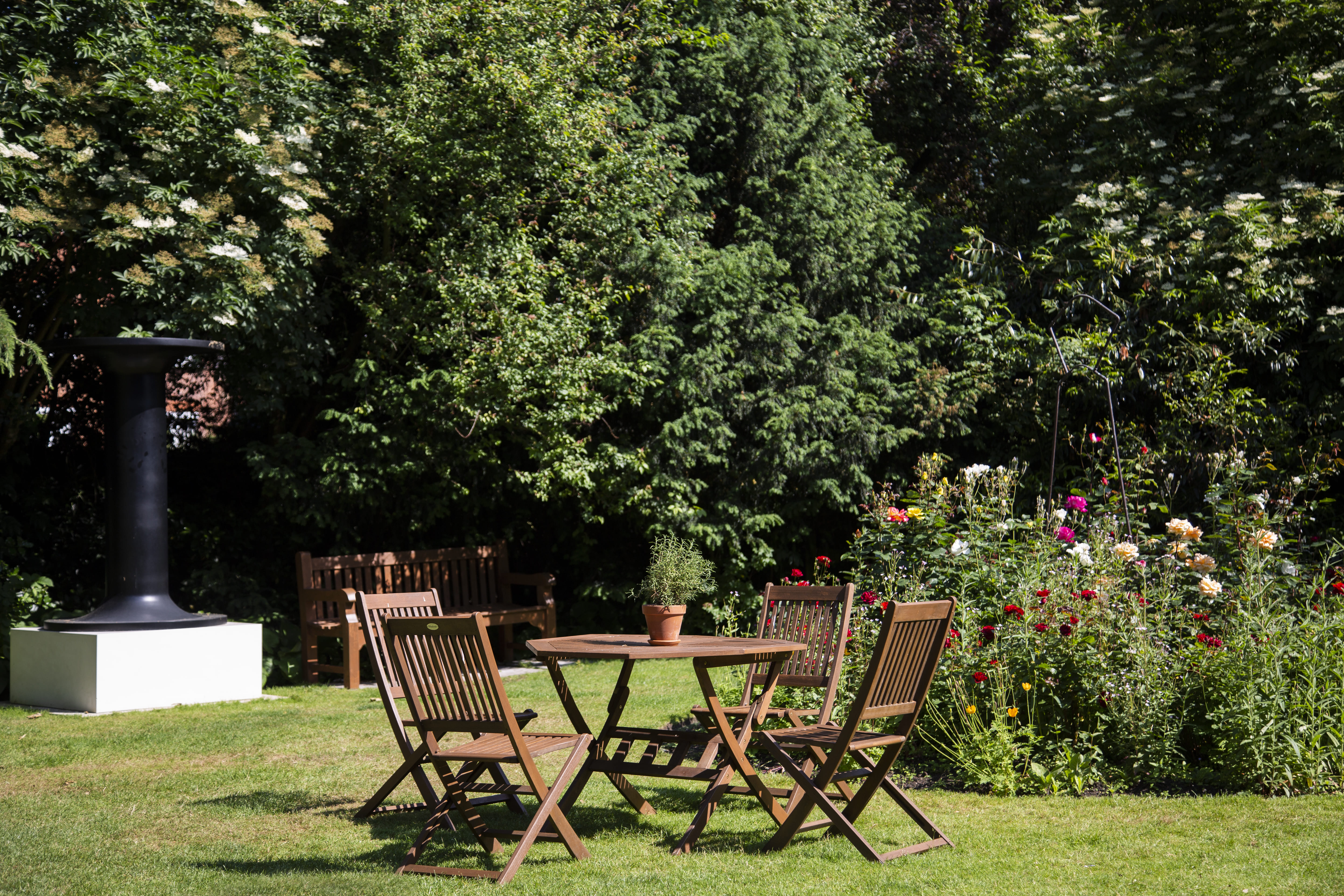 Freud Museum London outdoor space with wooden furniture for networking events.