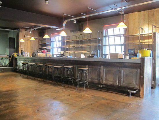 Spacious industrial bar at Arts Club Liverpool, perfect for networking events and gatherings.