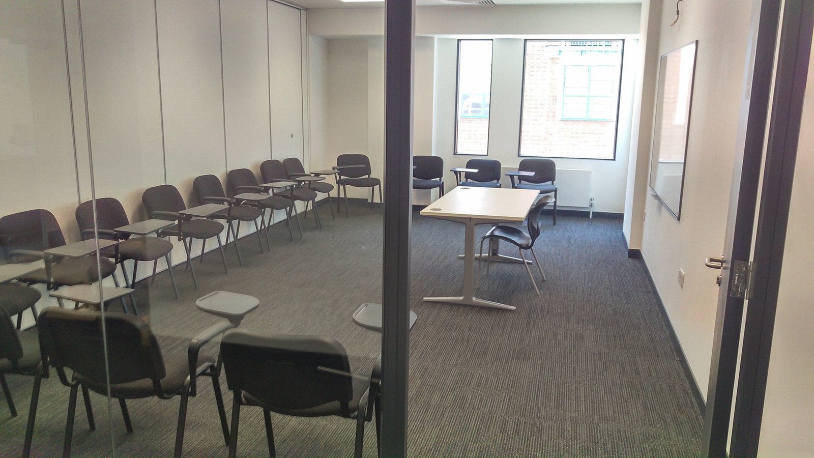 Modern meeting room with circular chairs for collaboration at Twin English Centre Greenwich.