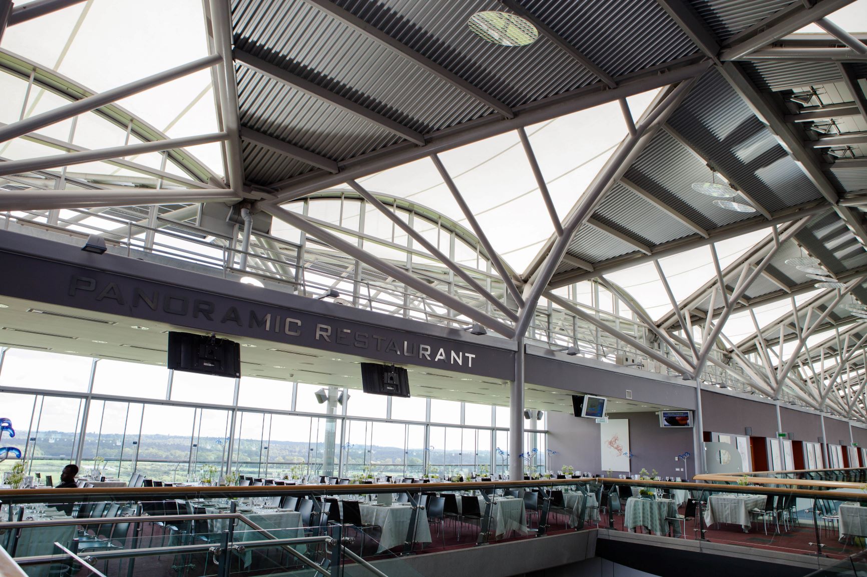 Panoramic Suite at Ascot Racecourse, modern venue for events with stunning views.