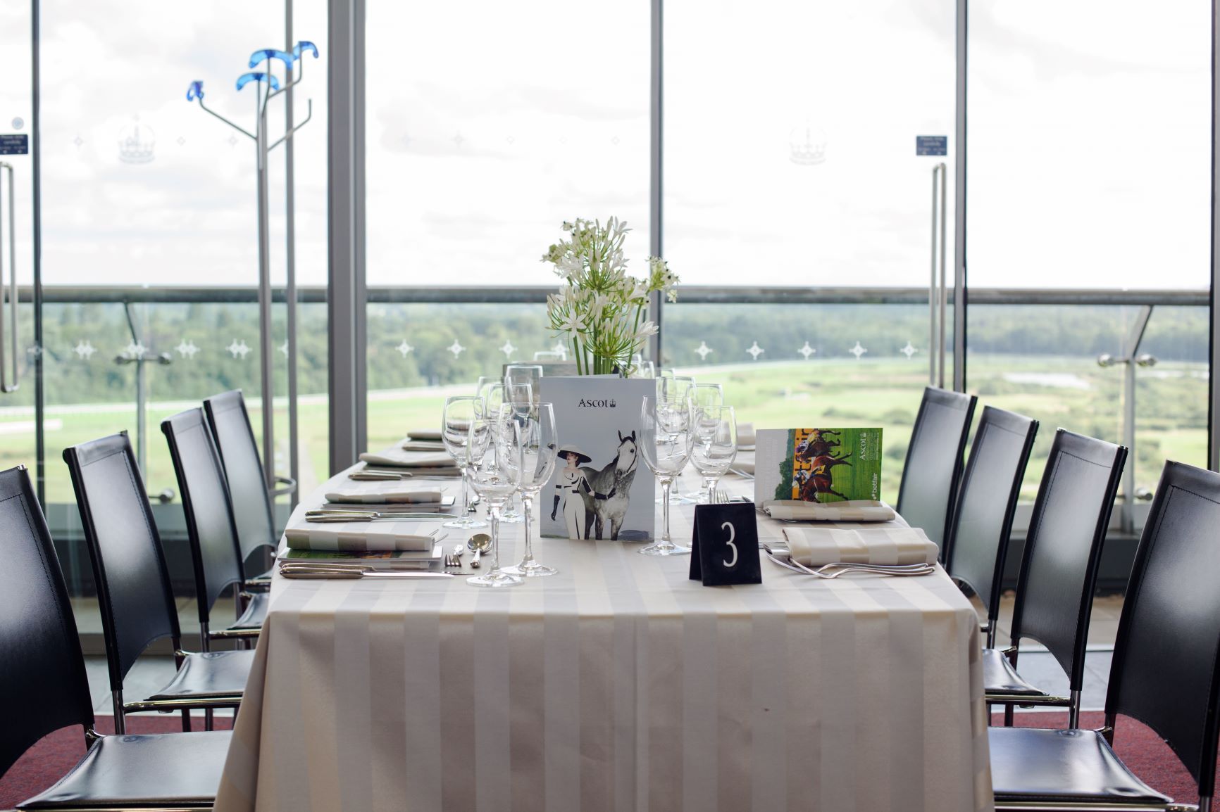 Panoramic Suite at Ascot Racecourse with elegant dining setup for corporate events.