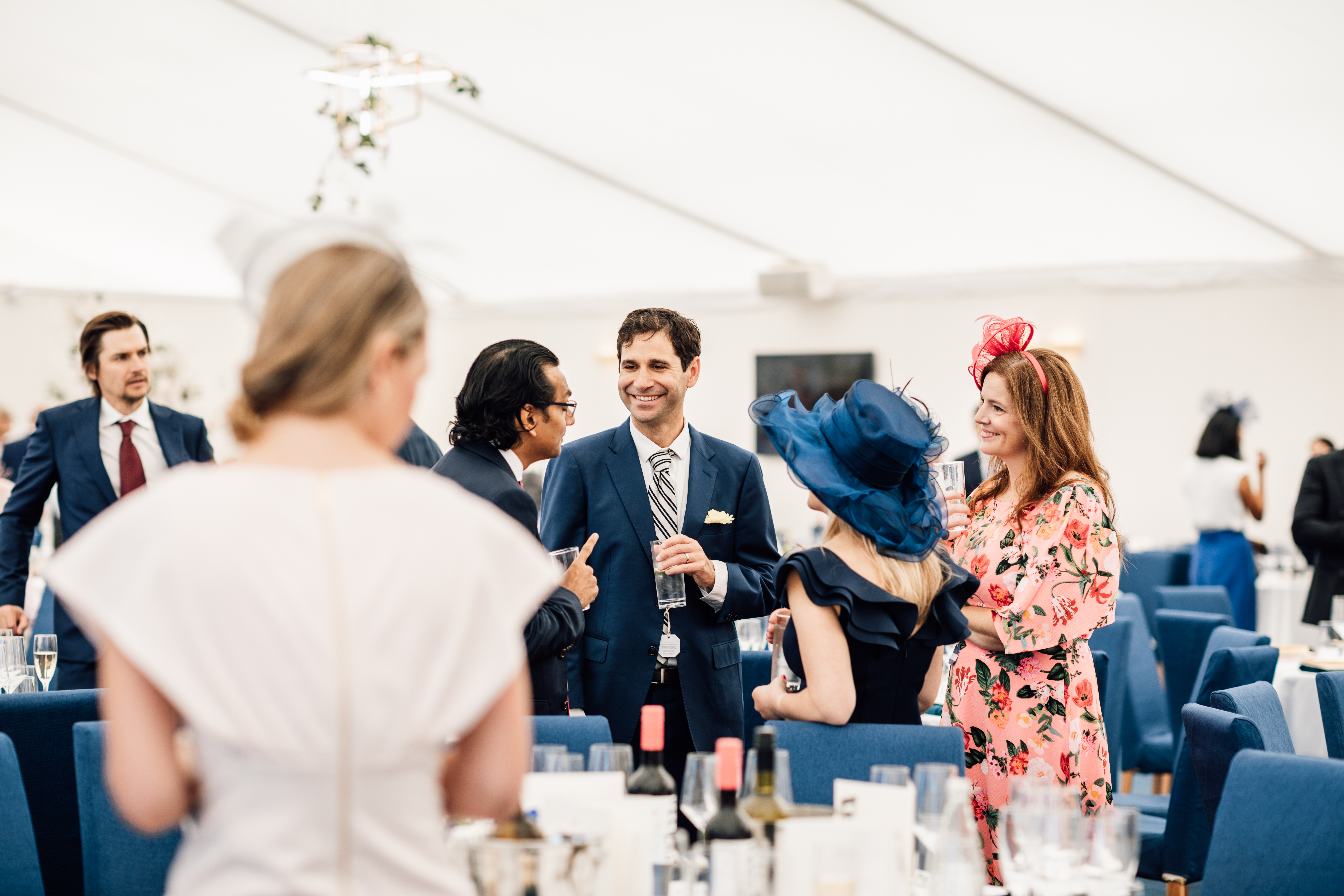 Elegant wedding in The Furlong Suite, Ascot Racecourse with stylish decor and guests.