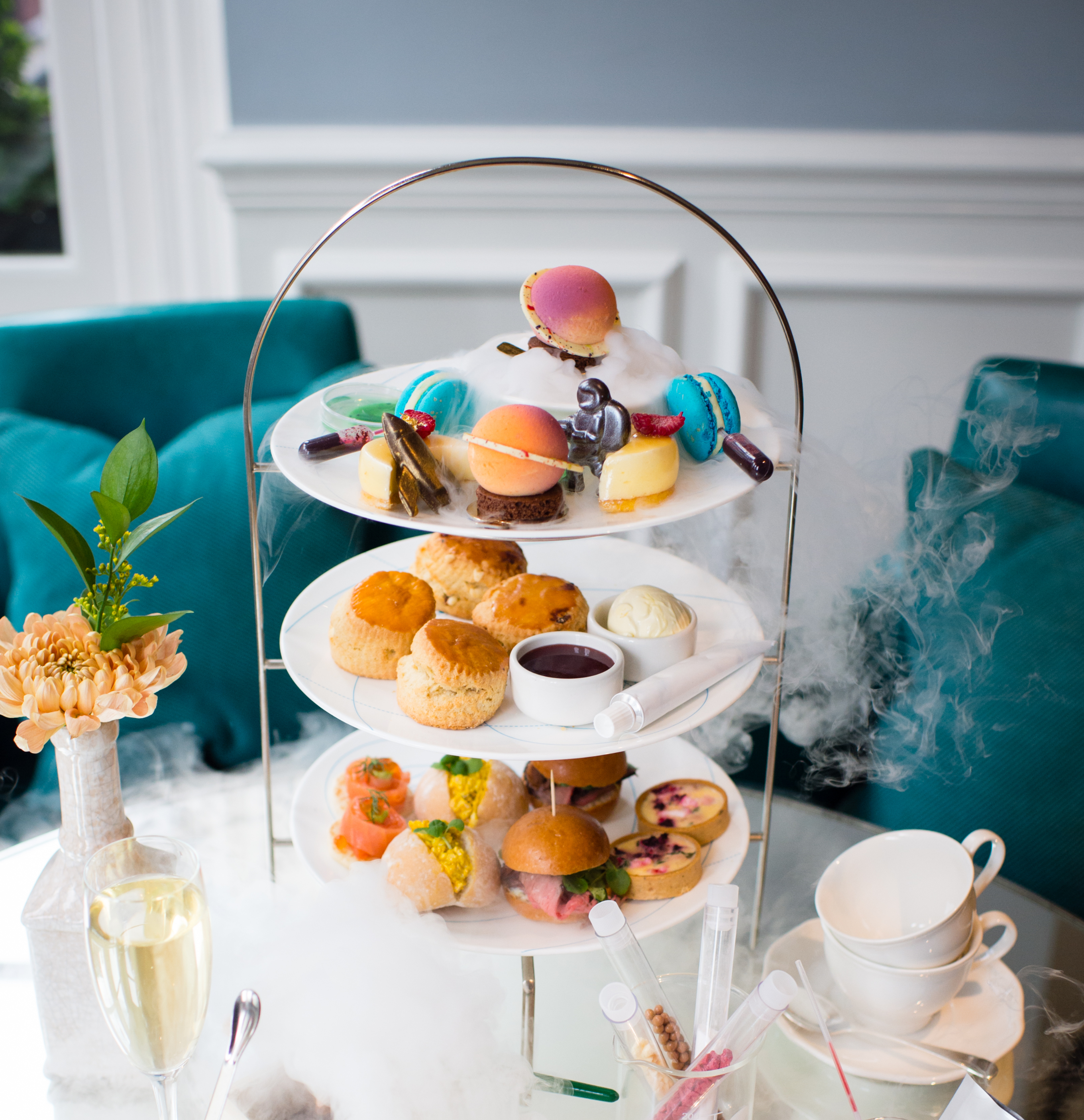 Elegant dessert display with macarons for upscale afternoon tea at The Ampersand Hotel.
