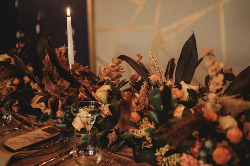 Elegant table setting with floral centerpiece for weddings and upscale events.