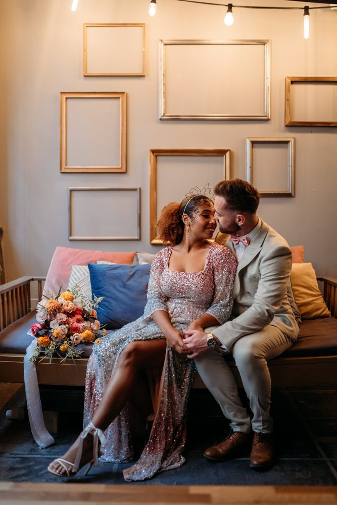 Elegant couple in romantic venue, perfect for weddings and engagement shoots.