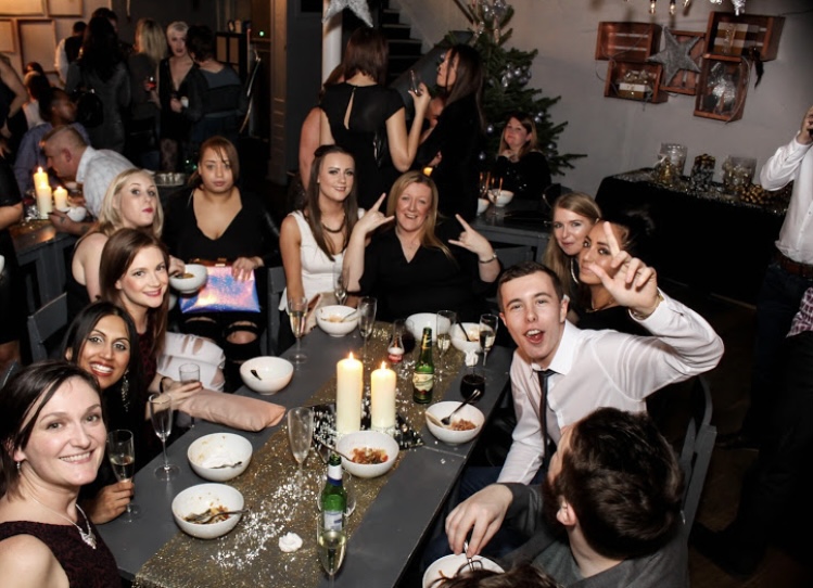 Lively networking event at The Venue on Middle St. with elegant decor and engaged guests.