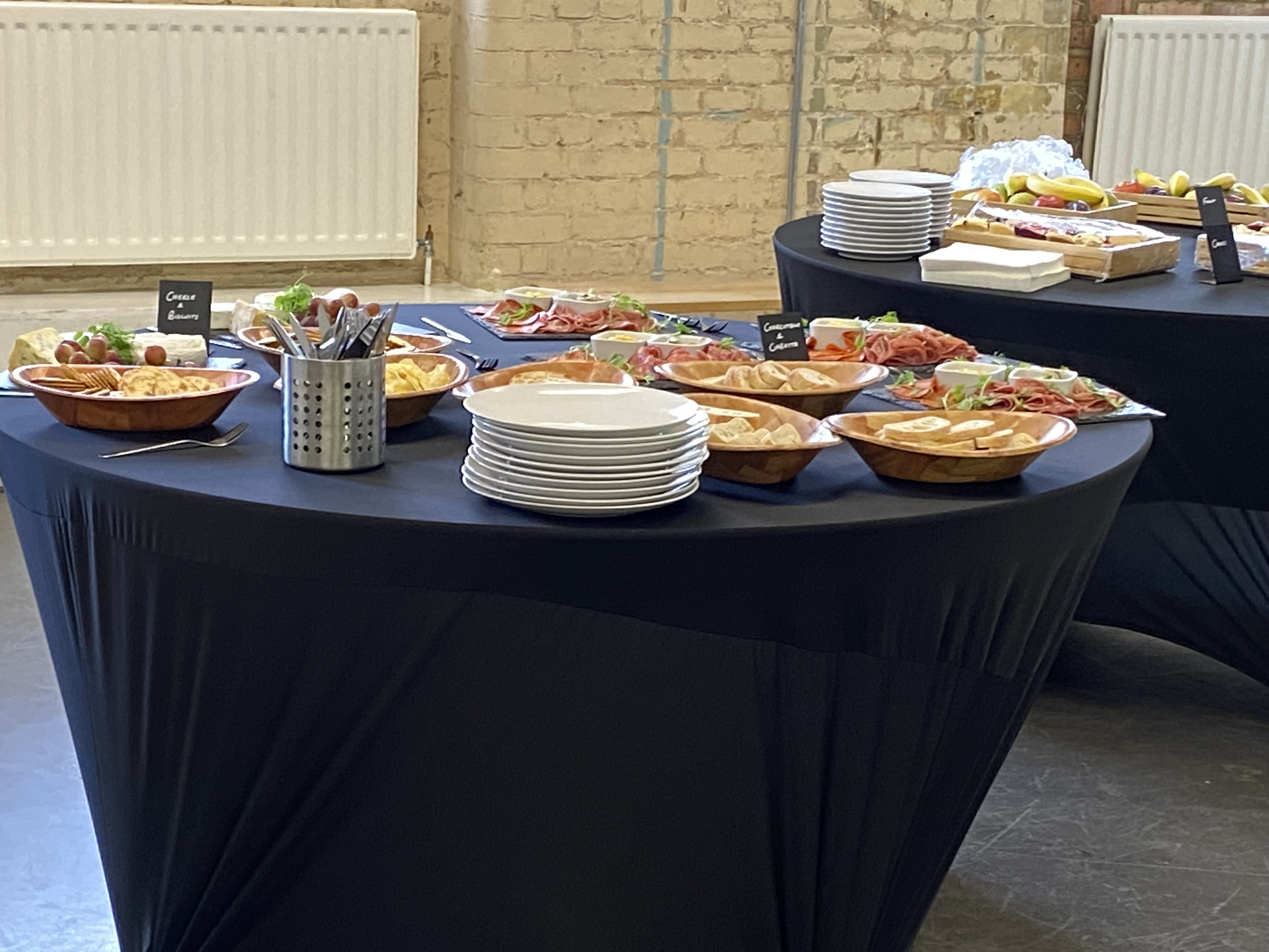 Buffet setup at Blue Anchor Studio, elegant dishes for networking events.