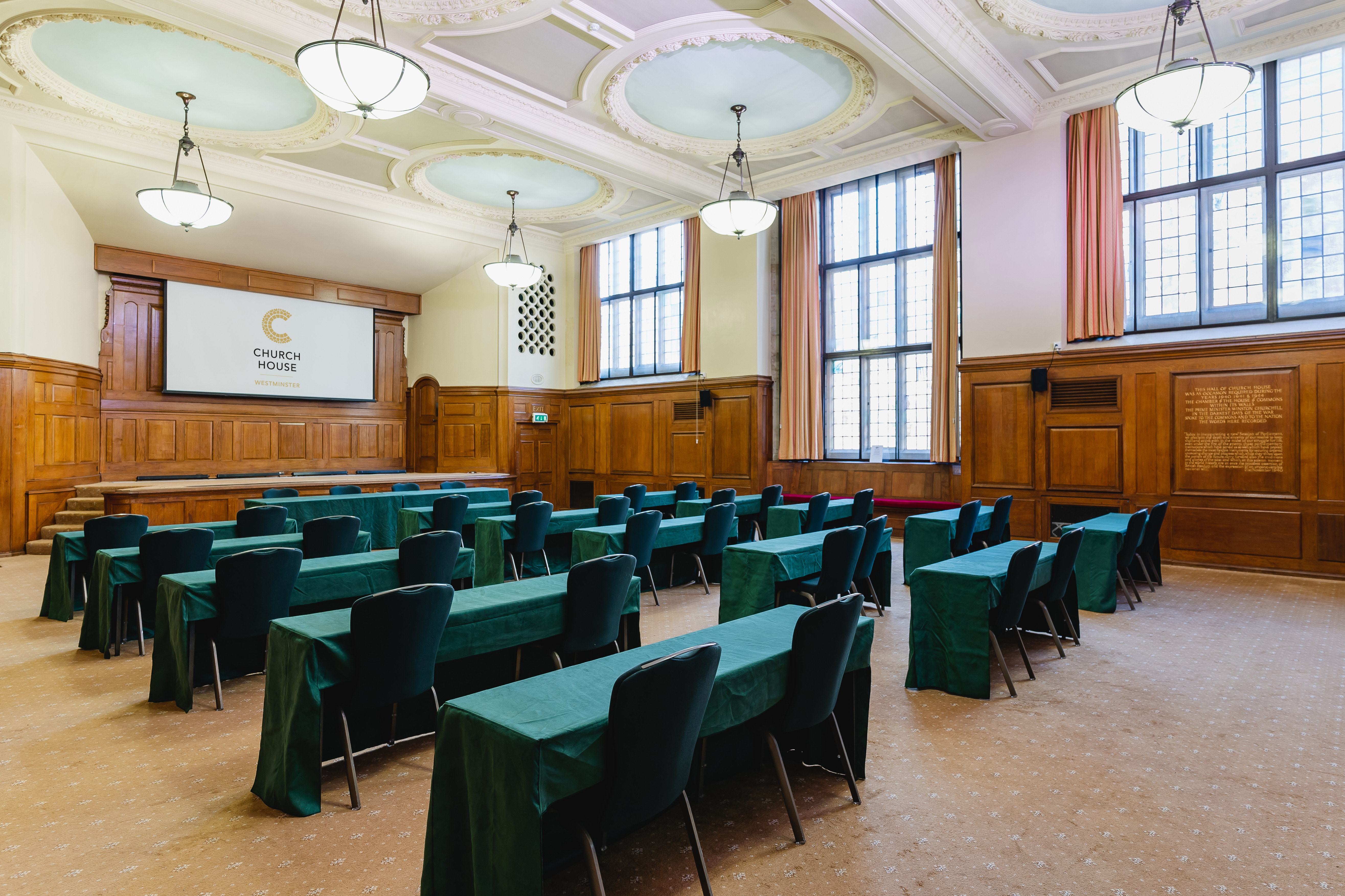 Hoare Memorial Hall meeting room with wooden paneling for professional events and presentations.