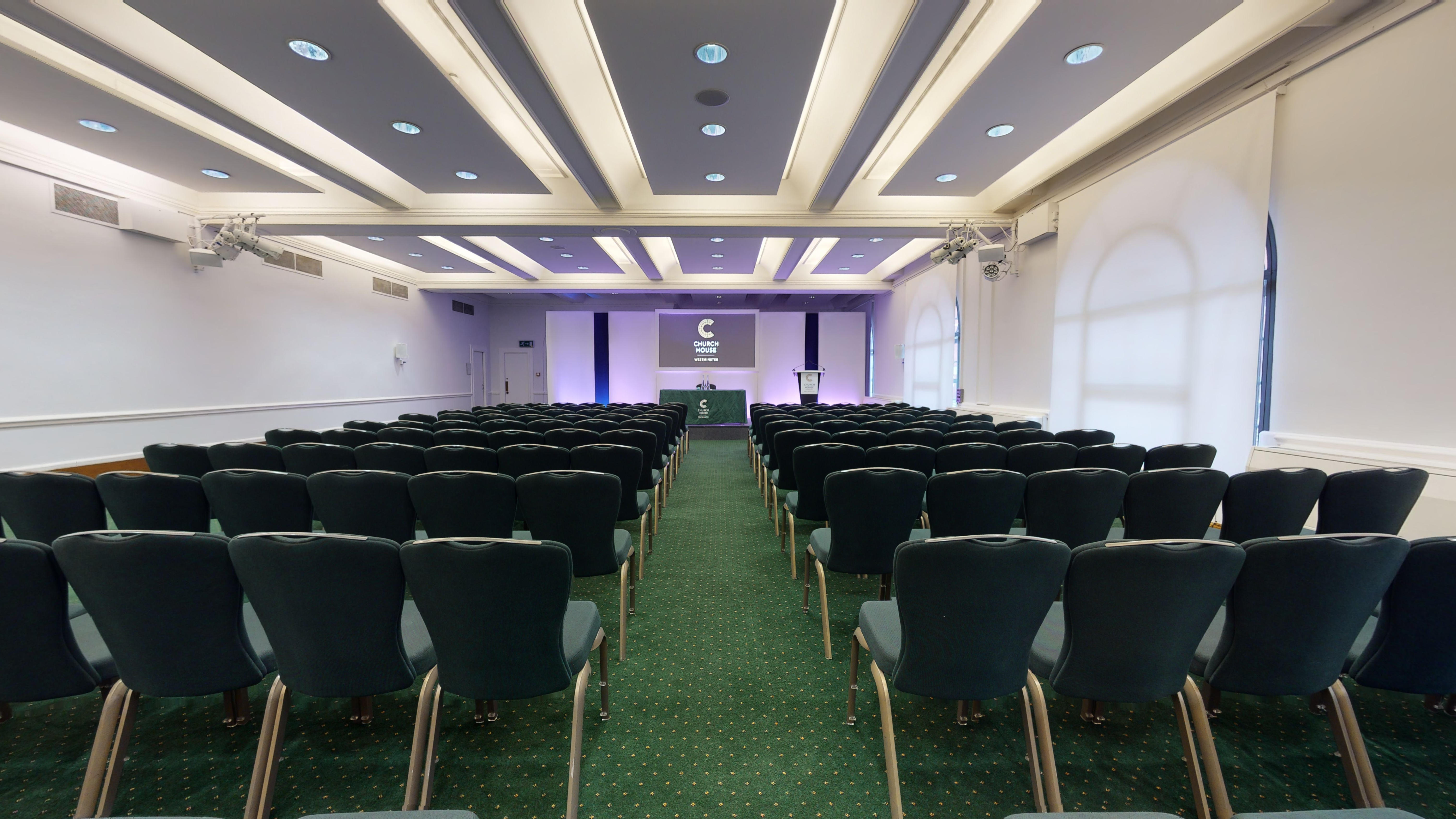Harvey Goodwin Suite conference room with purple accents, ideal for corporate events and seminars.